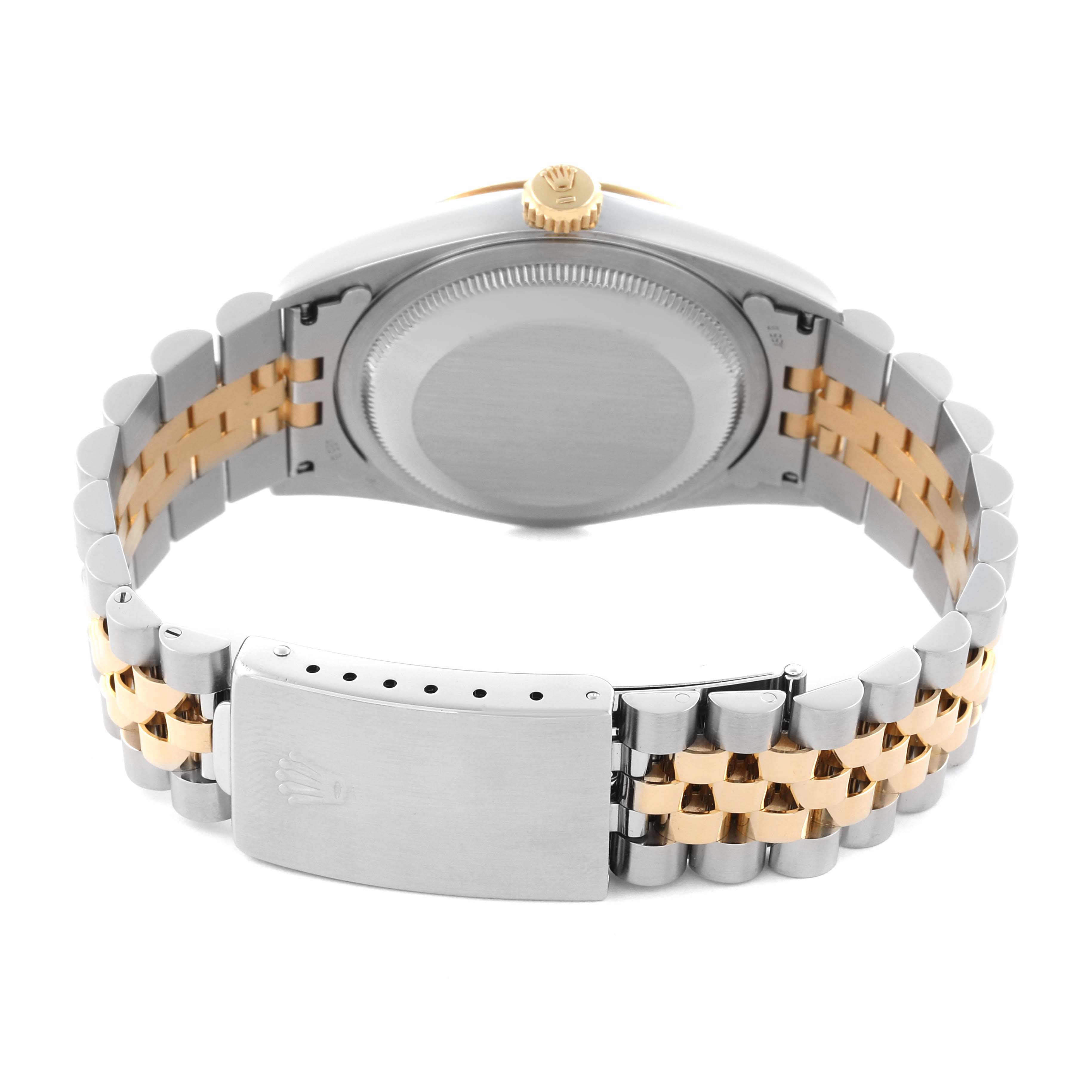 The Rolex Datejust 16233 Men's Steel and Gold (two tone) Grey Dial 16233 Men's Steel and Gold (two tone) Grey Dial watch is shown from the back, highlighting the two-tone bracelet and clasp.