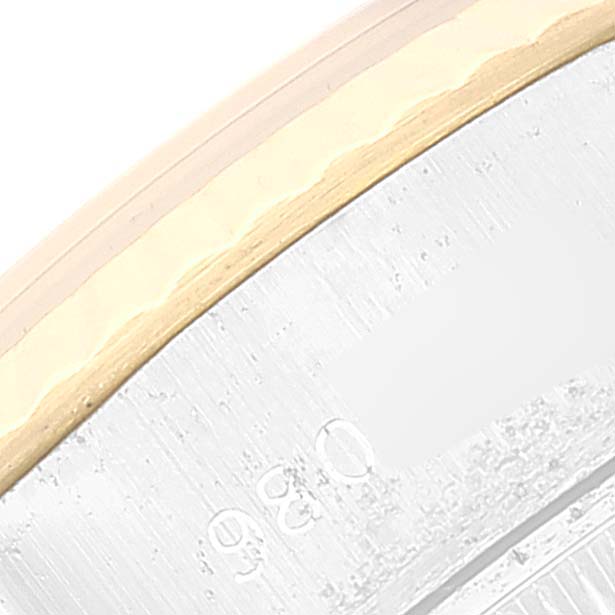This close-up image shows the edge of the case and the side of the bezel of a Rolex Datejust 69173 Women's Steel and Gold (two tone) White Dial 69173 Women's Steel and Gold (two tone) White Dial watch.