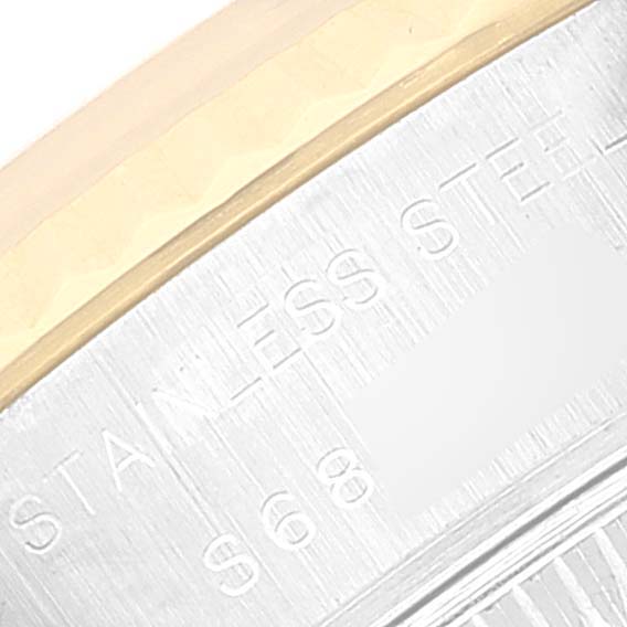 This close-up image shows the edge of the back casing of a Rolex Datejust 69173 Women's Steel and Gold (two tone) White Dial 69173 Women's Steel and Gold (two tone) White Dial watch, highlighting the "STAINLESS STEEL" engraving.
