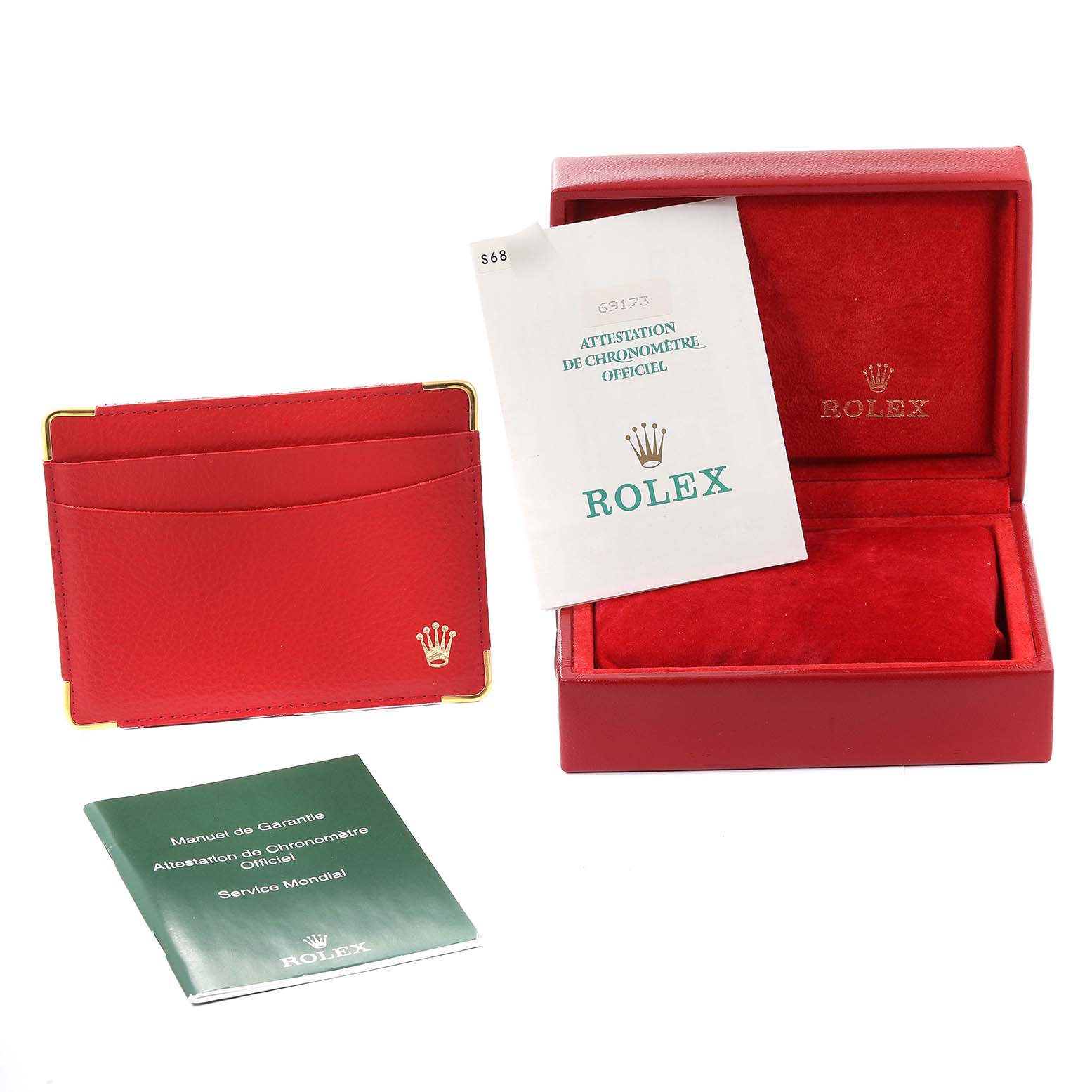The image shows accessories for the Rolex Datejust 69173 Women's Steel and Gold (two tone) White Dial 69173 Women's Steel and Gold (two tone) White Dial, including a red box, a leather cardholder, and manuals.