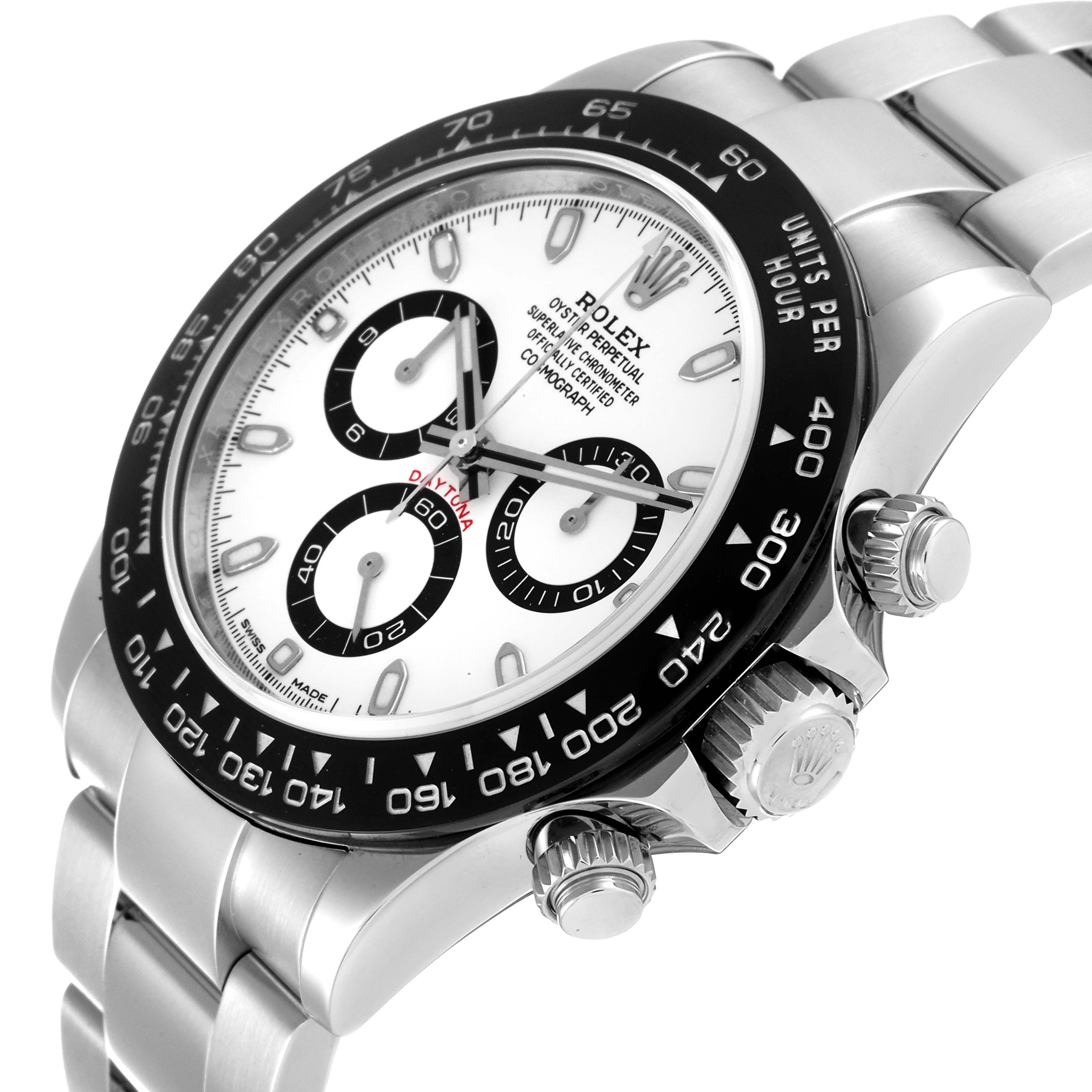 This image shows a side angle of a Rolex Daytona 116500 Men's Stainless Steel White Dial 116500 Men's Stainless Steel White Dial watch, focusing on the dial, bezel, and crown.