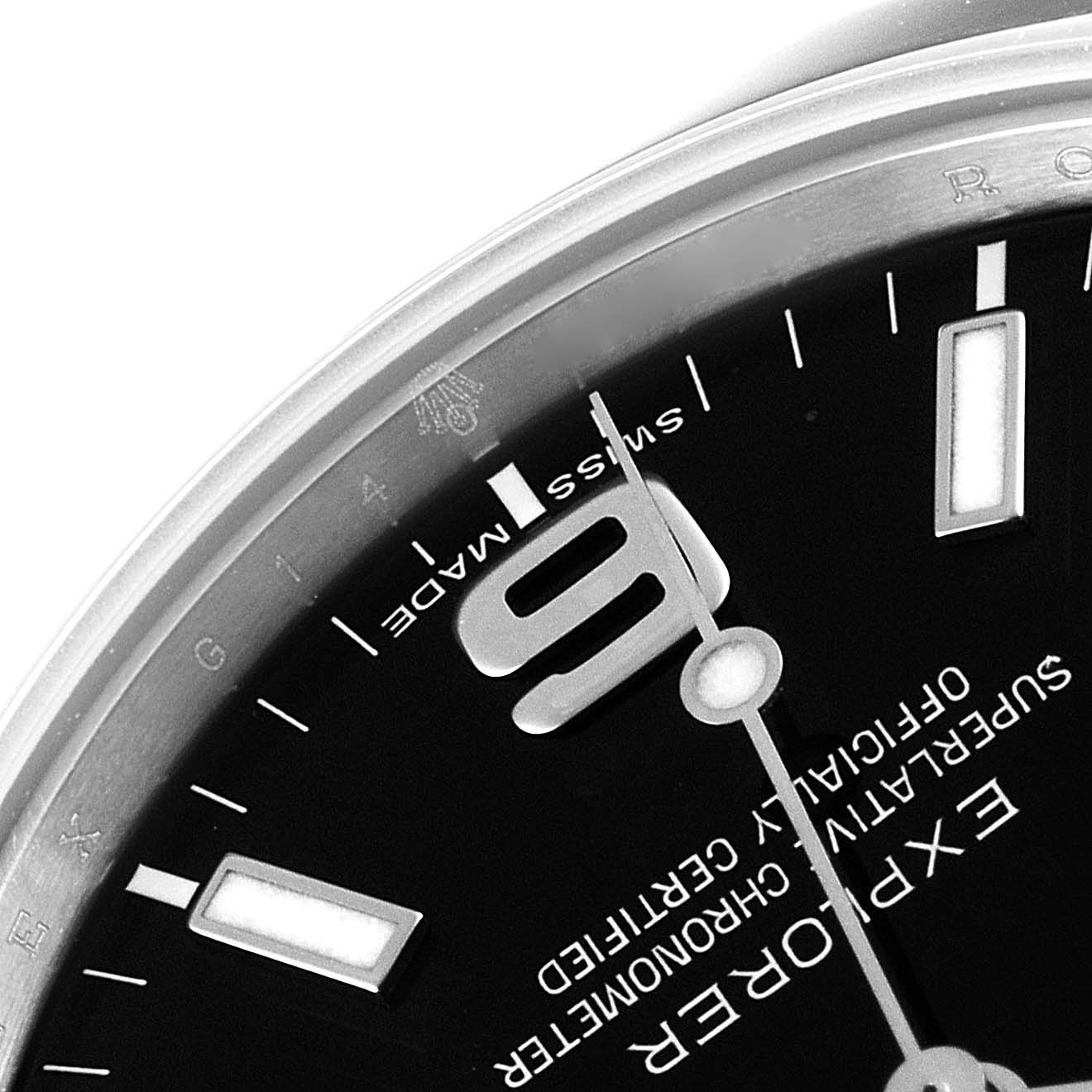 The image shows a close-up angled view of the dial and bezel of a Rolex Explorer 214270 Men's Stainless Steel Black Dial 214270 Men's Stainless Steel Black Dial watch, highlighting the 9 o'clock marker.