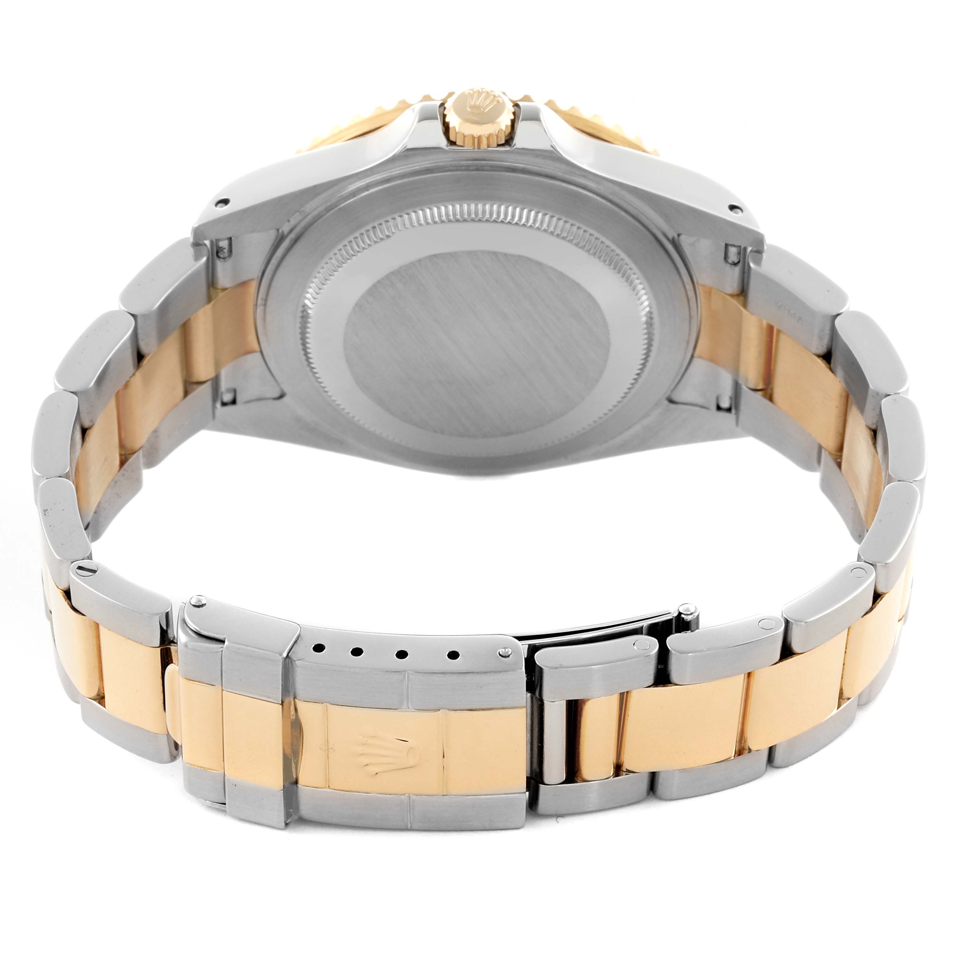 The Rolex GMT-Master 16713 Men's Steel and Gold (two tone) Brown Dial 16713 Men's Steel and Gold (two tone) Brown Dial watch is shown from the back, focusing on the case, crown, and two-tone bracelet.