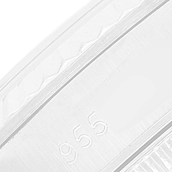 The image shows a close-up of the Rolex Oyster Perpetual 67194 Women
s Stainless Steel Silver Dial 67194 Women
s Stainless Steel Silver Dial watch
s band, highlighting the engraved "955" marking.