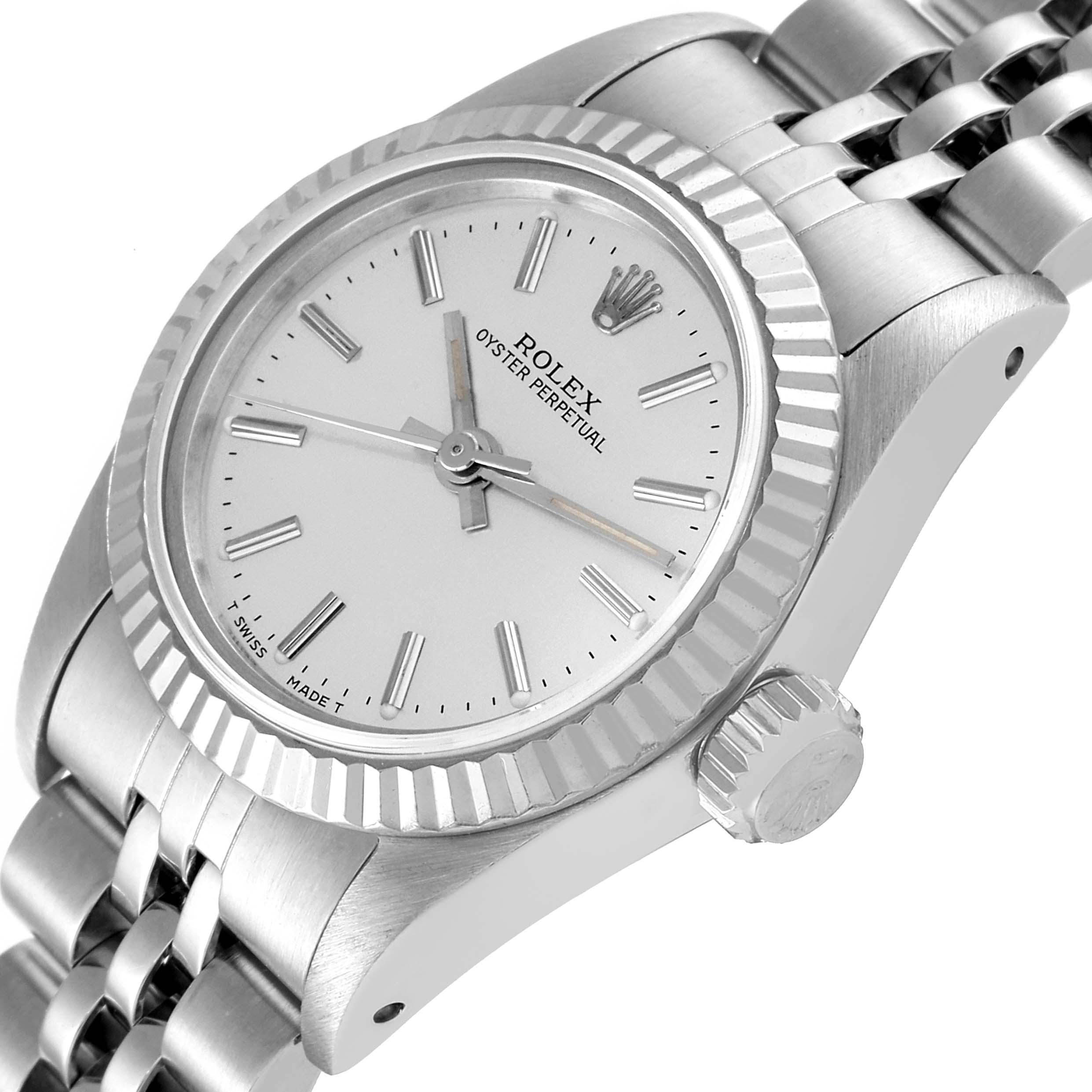 The image displays a Rolex Oyster Perpetual 67194 Women
s Stainless Steel Silver Dial 67194 Women
s Stainless Steel Silver Dial watch at a slight angle, showcasing its dial, bezel, crown, and part of the metal bracelet.