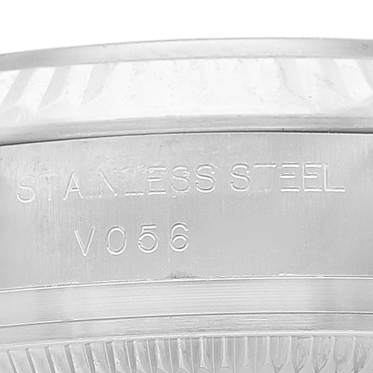 The image shows a close-up view of the case back side of a Rolex Oyster Perpetual 176234 Women
s Stainless Steel Pink Dial 176234 Women
s Stainless Steel Pink Dial watch, highlighting the stainless steel material and engravings.