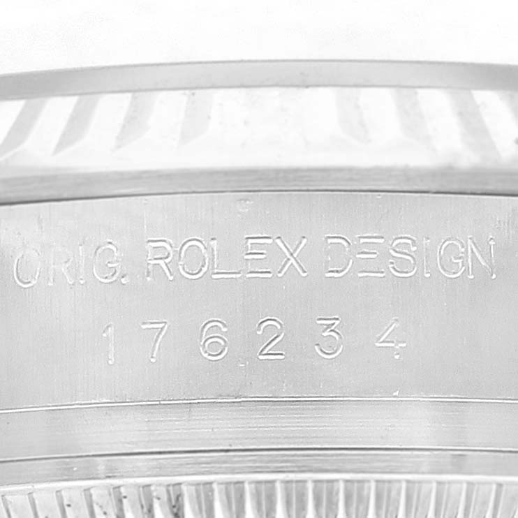 This image shows a close-up of the engraved serial number on the case side of a Rolex Oyster Perpetual 176234 Women
s Stainless Steel Pink Dial 176234 Women
s Stainless Steel Pink Dial watch.