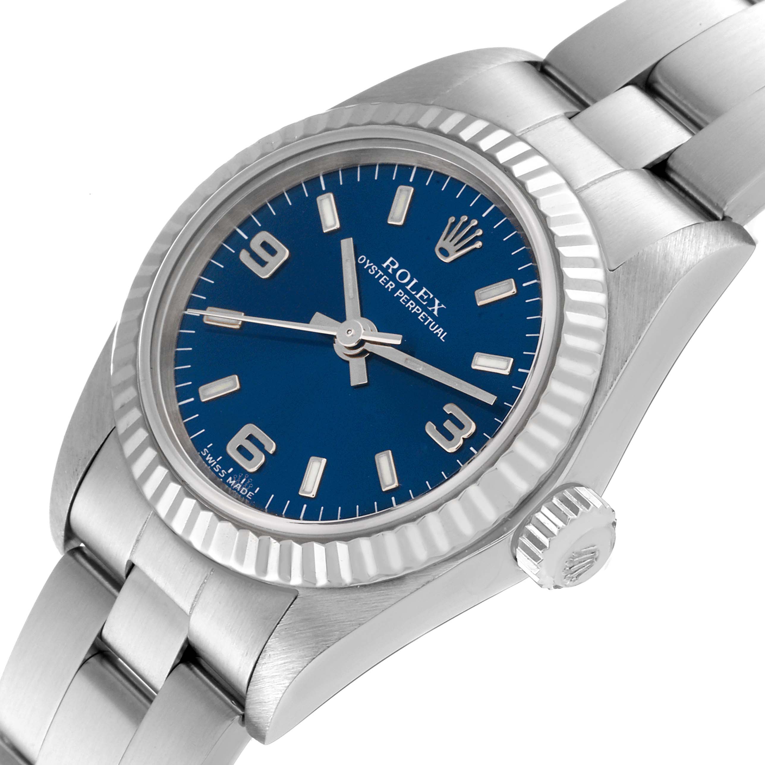 The image shows a Rolex Oyster Perpetual 76094 Women's Stainless Steel Blue Dial 76094 Women's Stainless Steel Blue Dial watch angled slightly from the right, displaying its face, bezel, case, and part of the bracelet.