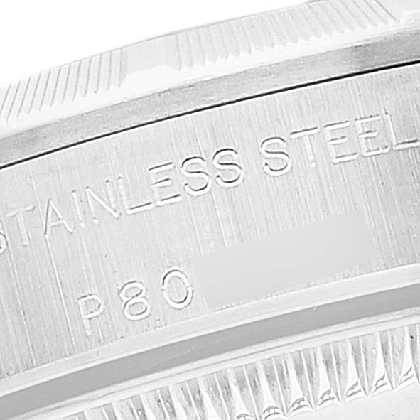 This image shows a close-up of the casing side of a Rolex Oyster Perpetual 76030 Women's Stainless Steel Black Dial 76030 Women's Stainless Steel Black Dial watch, highlighting the engraved "STAINLESS STEEL."
