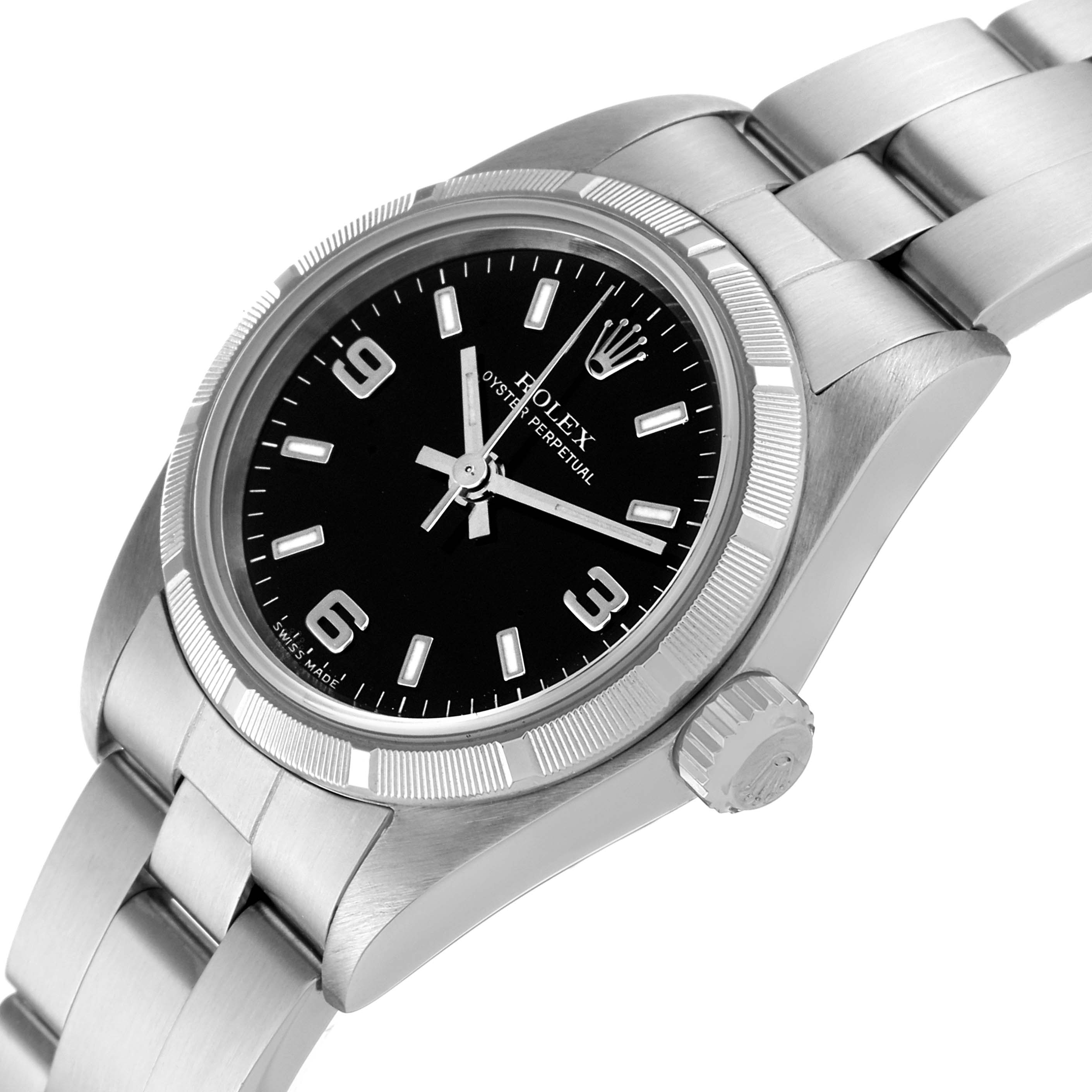 The Rolex Oyster Perpetual 76030 Women's Stainless Steel Black Dial 76030 Women's Stainless Steel Black Dial watch is shown at a three-quarter angle, highlighting the face, bezel, and part of the bracelet.