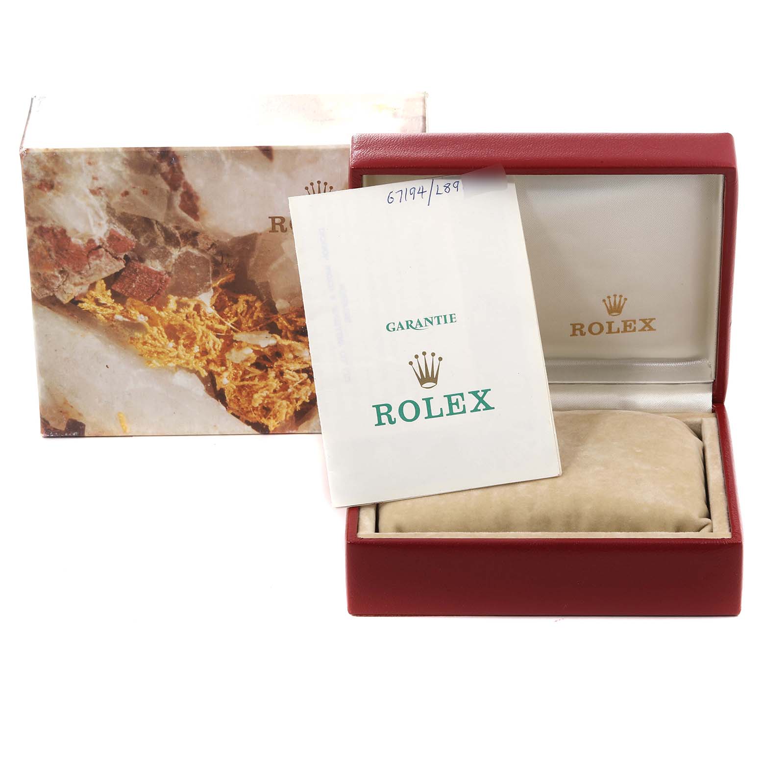 The image shows the box and guarantee certificate for a Rolex Oyster Perpetual 67194 Women's Stainless Steel Silver Dial 67194 Women's Stainless Steel Silver Dial watch, with the watch box partially open.