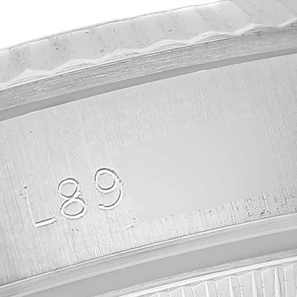 This image shows a close-up of the reference number engraving on the inner bezel of a Rolex Oyster Perpetual 67194 Women's Stainless Steel Silver Dial 67194 Women's Stainless Steel Silver Dial watch.