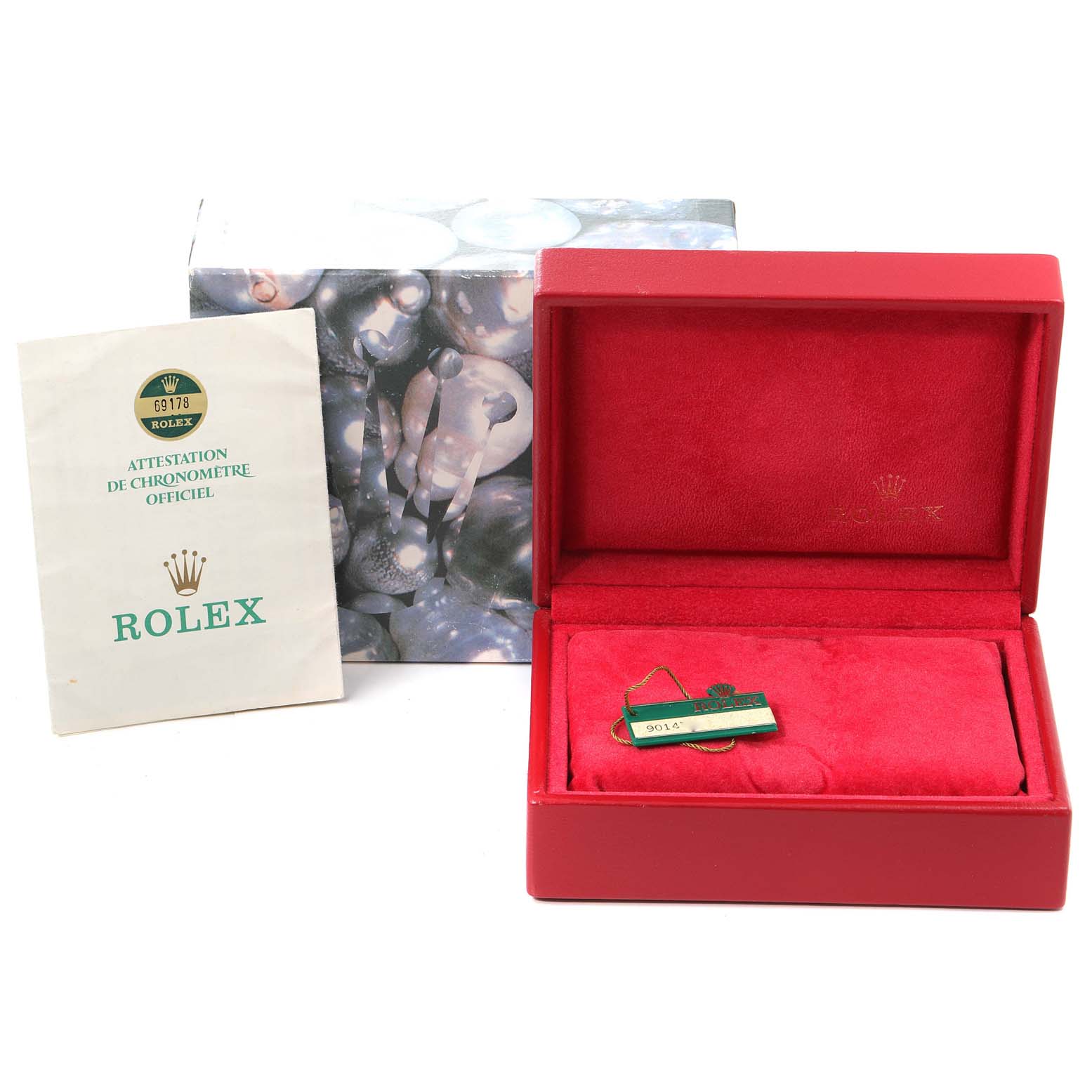 The image shows a Rolex President 69178 Women
s Yellow Gold White Dial 69178 Women
s Yellow Gold White Dial watch
s accessories, including a red velvet box, a certificate, and a tag.