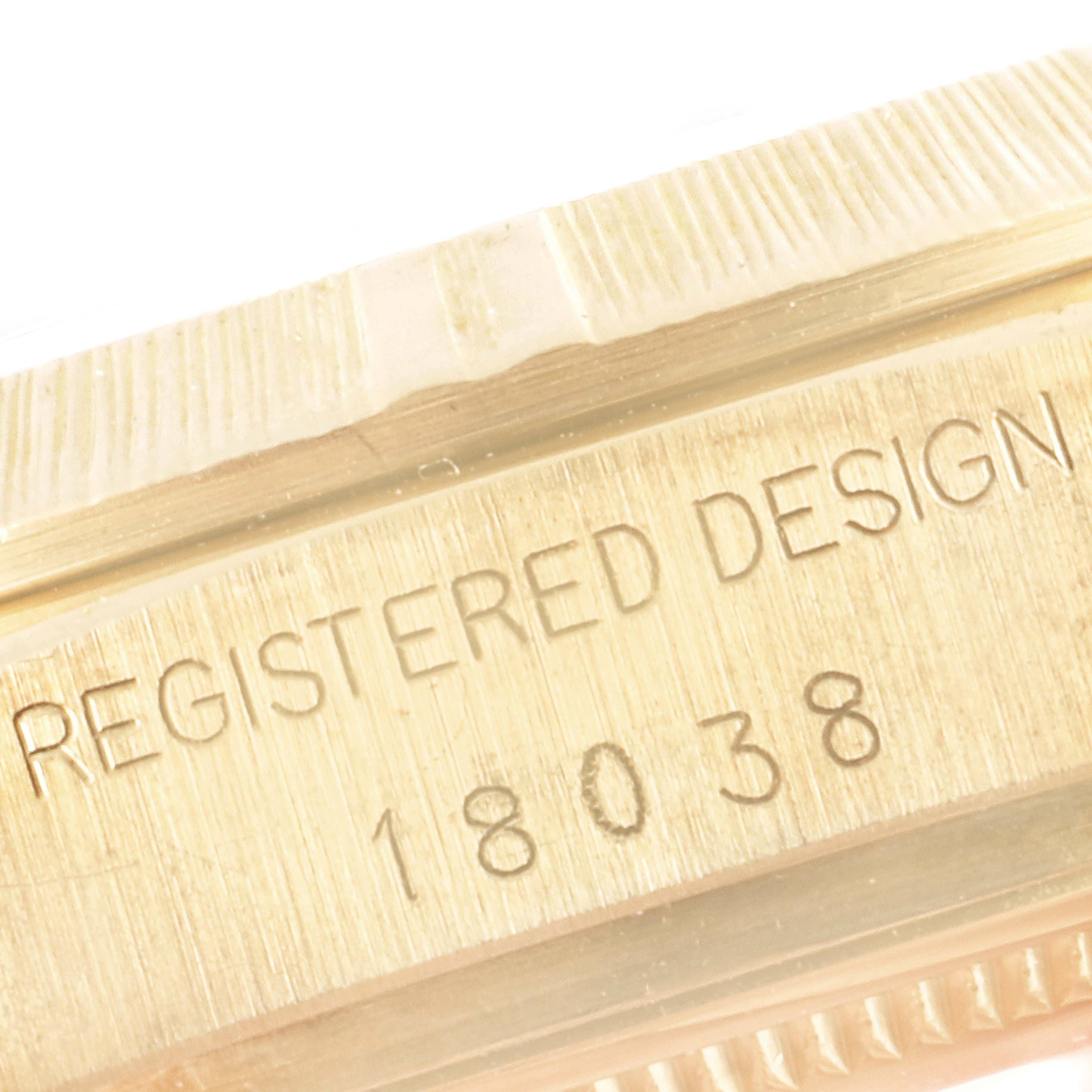 This image shows a close-up of the model number and "REGISTERED DESIGN" engraving on the side of a Rolex President 18038 Men's Yellow Gold Champagne Dial 18038 Men's Yellow Gold Champagne Dial watch.