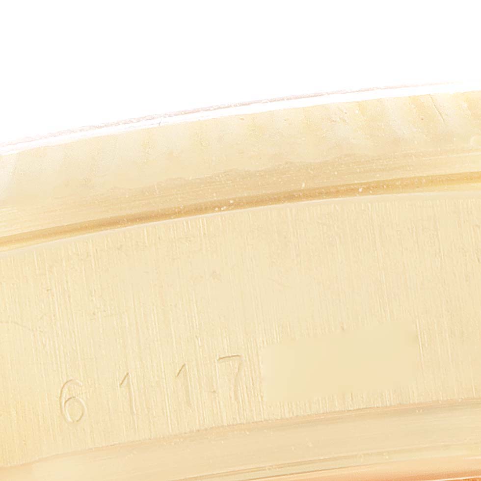 The image shows a close-up of the Rolex President 18038 Men's Yellow Gold Champagne Dial 18038 Men's Yellow Gold Champagne Dial model's serial number and bezel area.