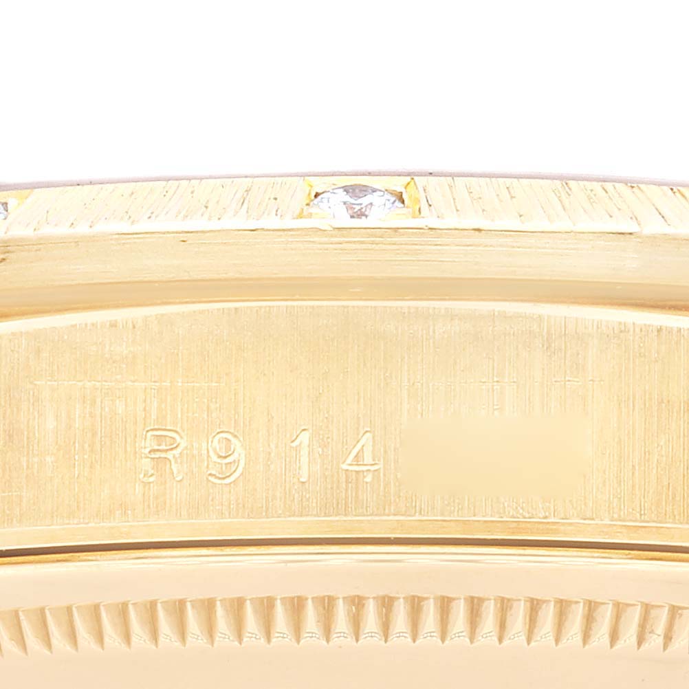 This image shows a close-up view of the side of a Rolex President 18308 Men's Yellow Gold Champagne Dial 18308 Men's Yellow Gold Champagne Dial model watch, featuring the engraved reference number and part of the bezel.
