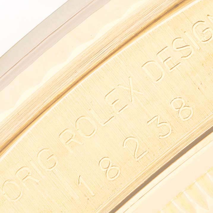 This close-up image shows the engraved model number and "Rolex Design" on the case of the President model by Rolex.