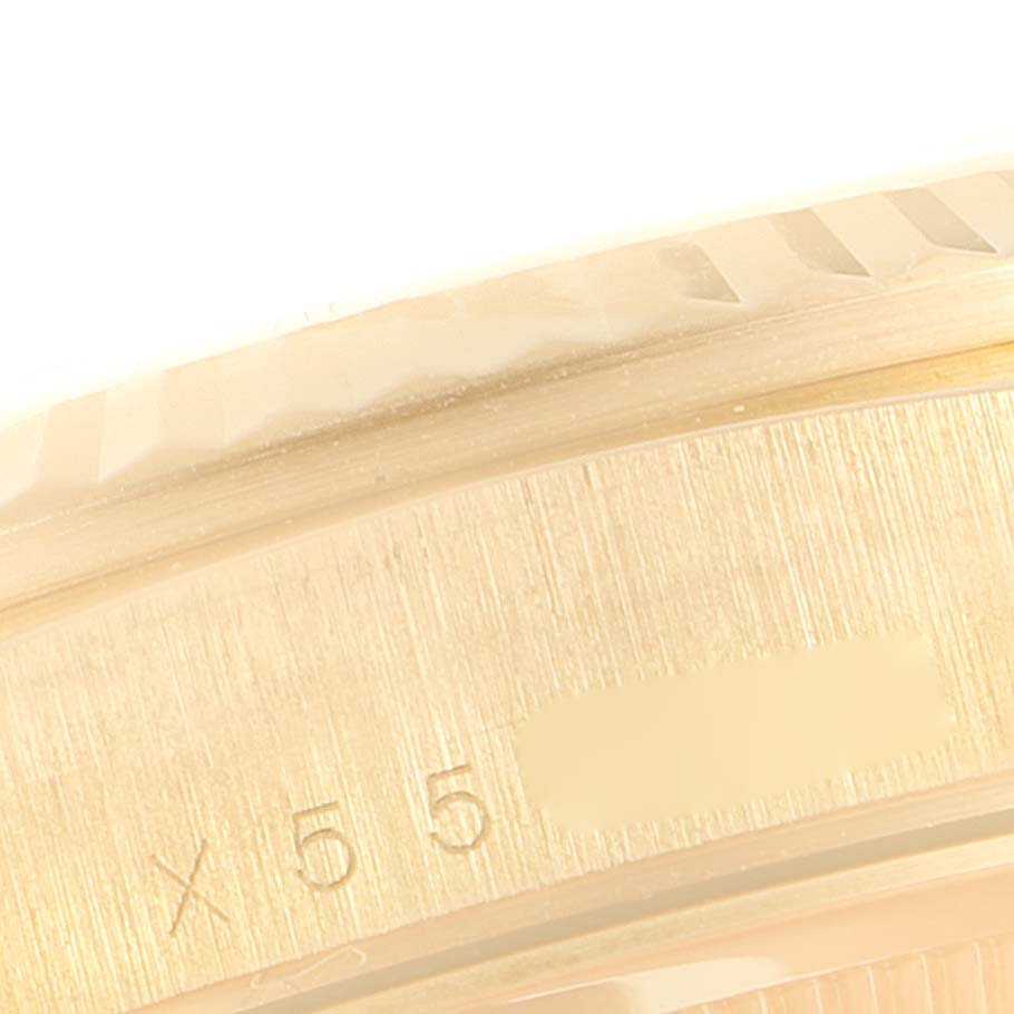 This image shows a close-up of the outer edge and serial number of a Rolex President 18238 Men
s Yellow Gold Champagne Dial 18238 Men
s Yellow Gold Champagne Dial model watch.
