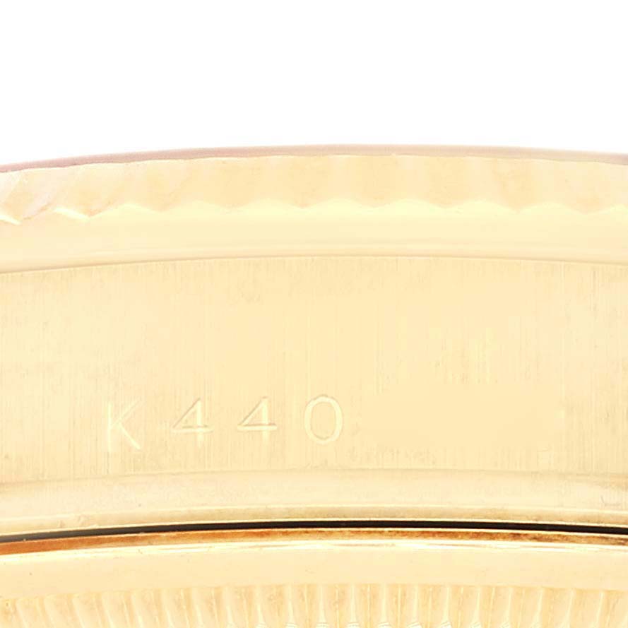 The image shows a close-up of the serial number on the bezel of a Rolex President 118238 Men's Yellow Gold Champagne Dial 118238 Men's Yellow Gold Champagne Dial model watch.