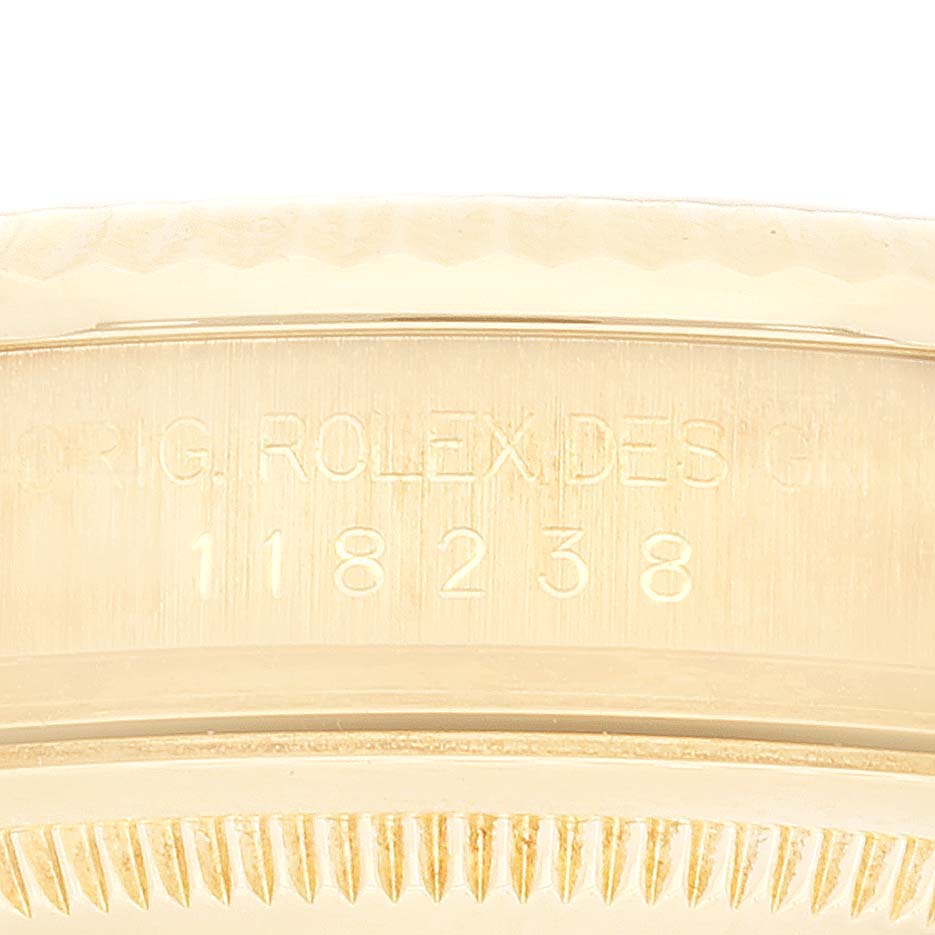 This close-up image shows the case and bezel of a Rolex President 118238 Men's Yellow Gold Champagne Dial 118238 Men's Yellow Gold Champagne Dial model, with the model number 118238 engraved on the case.