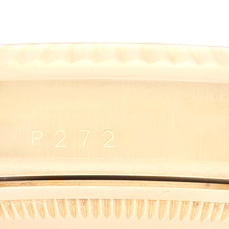 The image shows a close-up of the serial number engraved on the case of a Rolex President 118238 Men's Yellow Gold Champagne Dial 118238 Men's Yellow Gold Champagne Dial model watch.