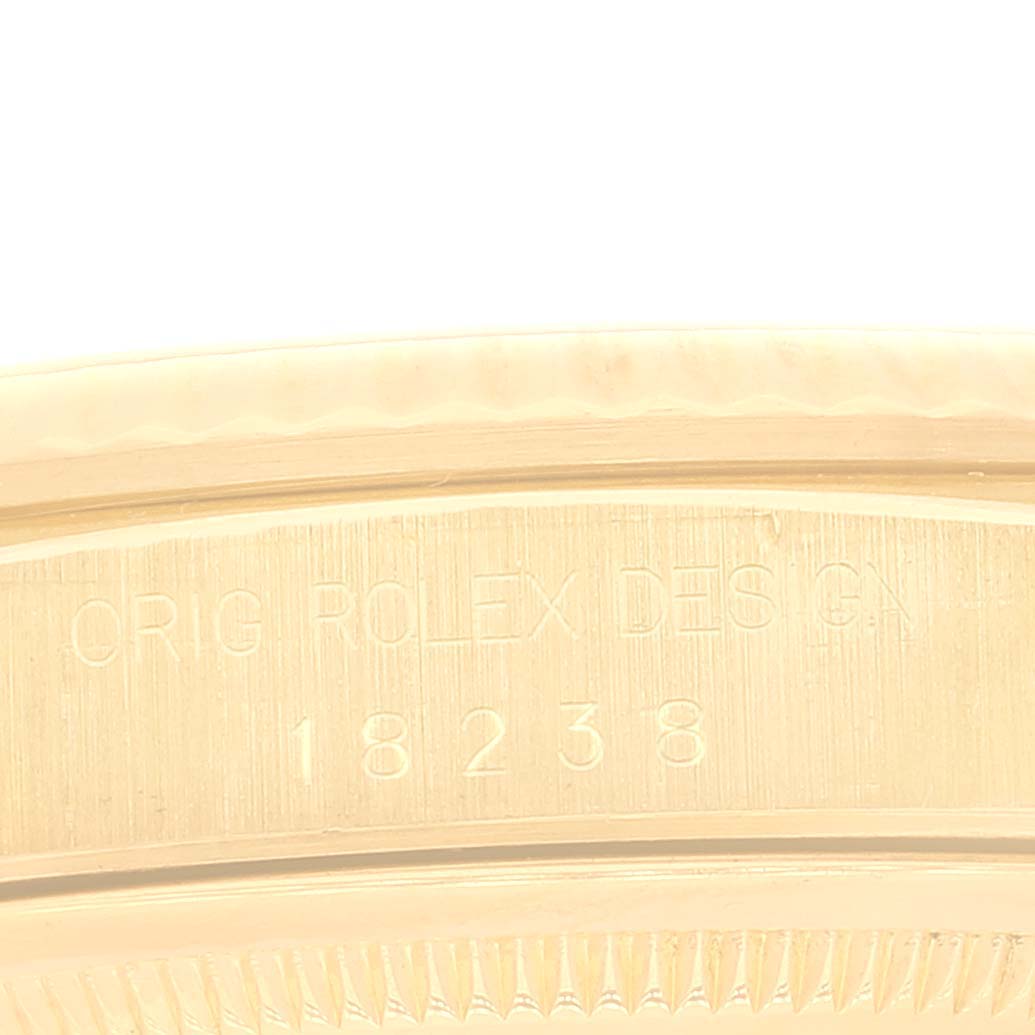 The image shows the side of the case of a Rolex President 18238 Men's Yellow Gold Mother of Pearl Dial 18238 Men's Yellow Gold Mother of Pearl Dial model watch, featuring the engraved design number 18238.