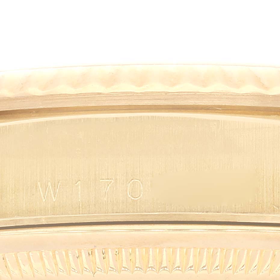 This image shows a close-up of the side of a Rolex President 18238 Men's Yellow Gold Mother of Pearl Dial 18238 Men's Yellow Gold Mother of Pearl Dial model, focusing on the serial number engraving.