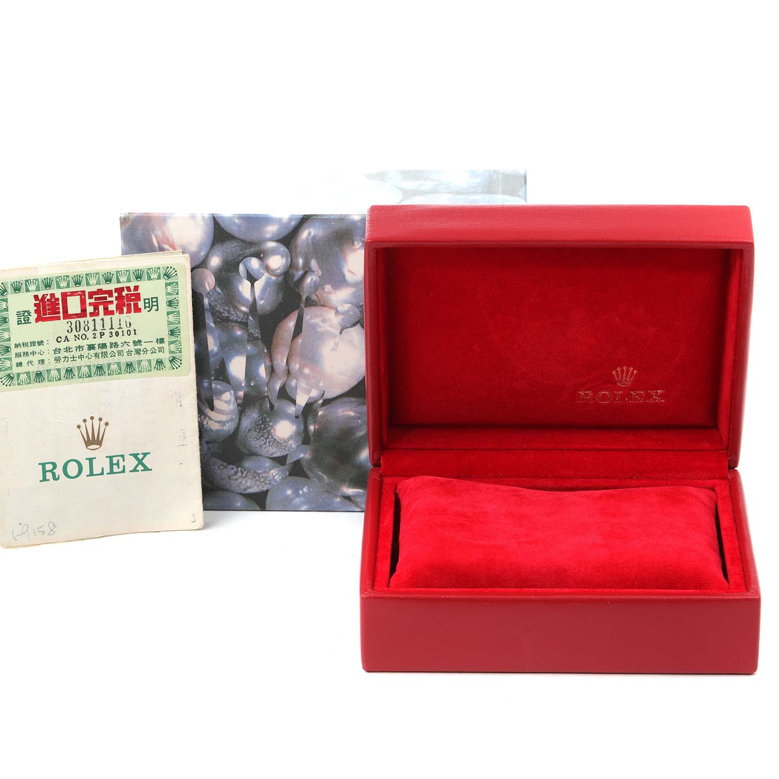 The image shows a Rolex President 69158 Women
s Yellow Gold  69158 Women
s Yellow Gold  watch
s red box, a booklet, and outer packaging.