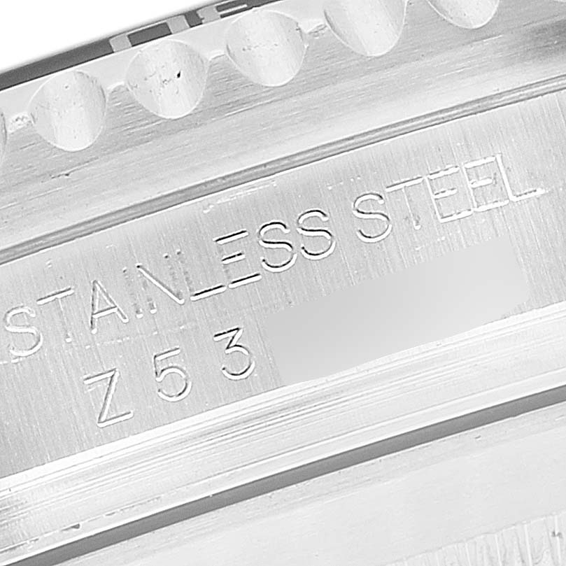 The image shows a close-up of the inner bezel and case engraving on the Rolex Sea-Dweller 16600 Men
s Stainless Steel Black Dial 16600 Men
s Stainless Steel Black Dial, displaying "STAINLESS STEEL" and a serial number.