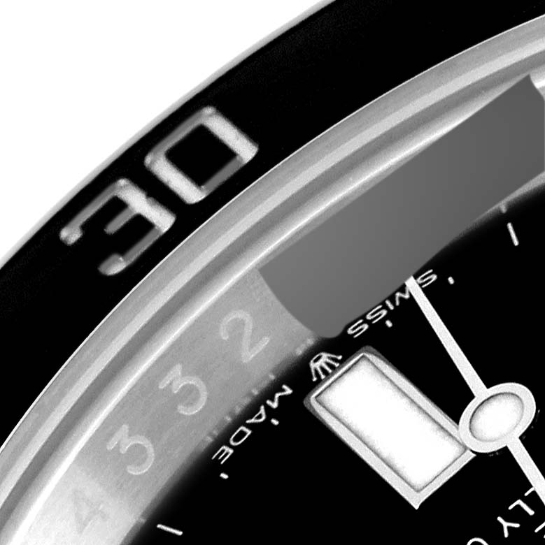 The image shows a close-up angle of the bezel and part of the dial of a Rolex Submariner 126610LN Men
s Stainless Steel Black Dial 126610LN Men
s Stainless Steel Black Dial watch.