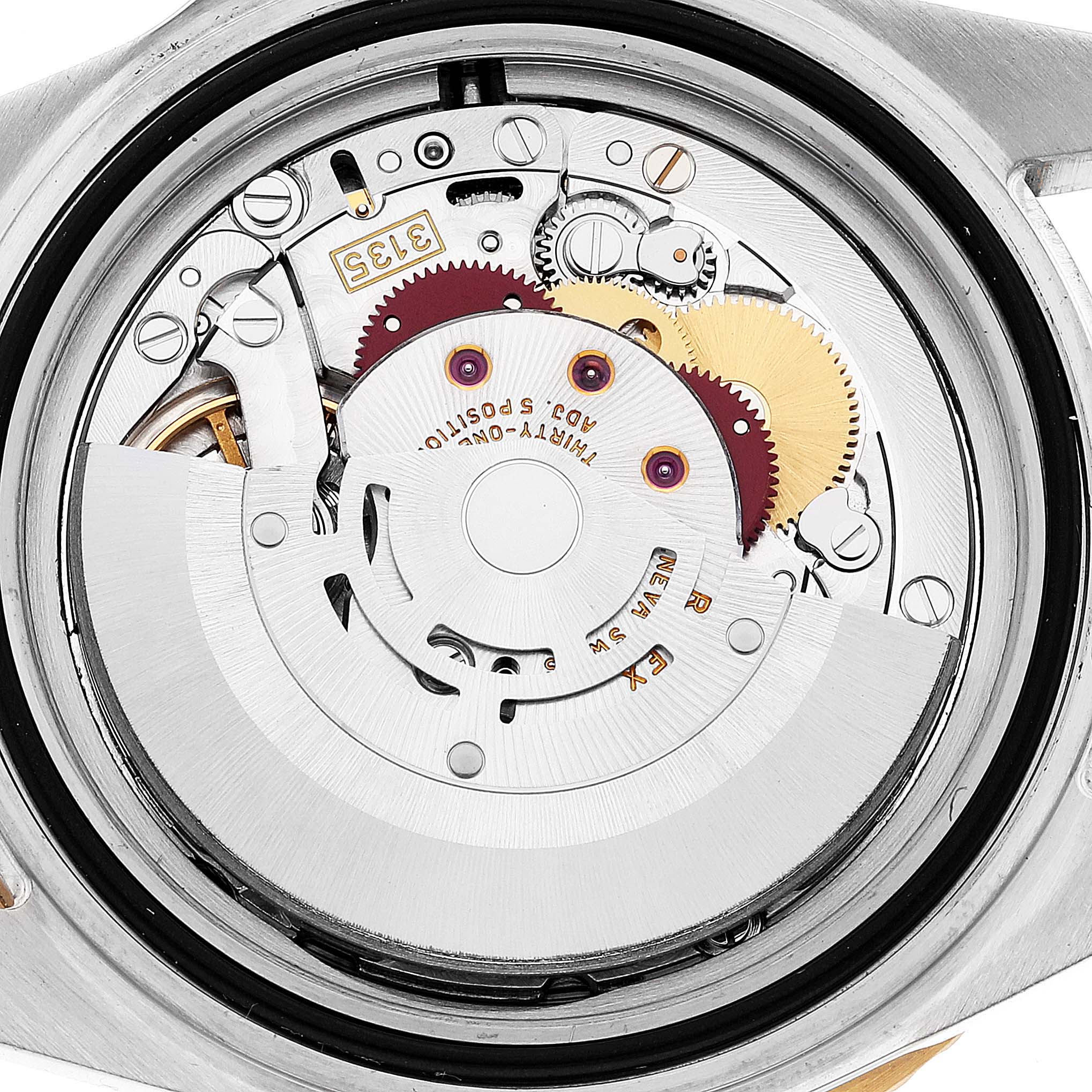 The image shows a close-up view of the movement and internal mechanism of a Rolex Submariner 16613 Men's Steel and Gold (two tone) Blue Dial 16613 Men's Steel and Gold (two tone) Blue Dial watch.