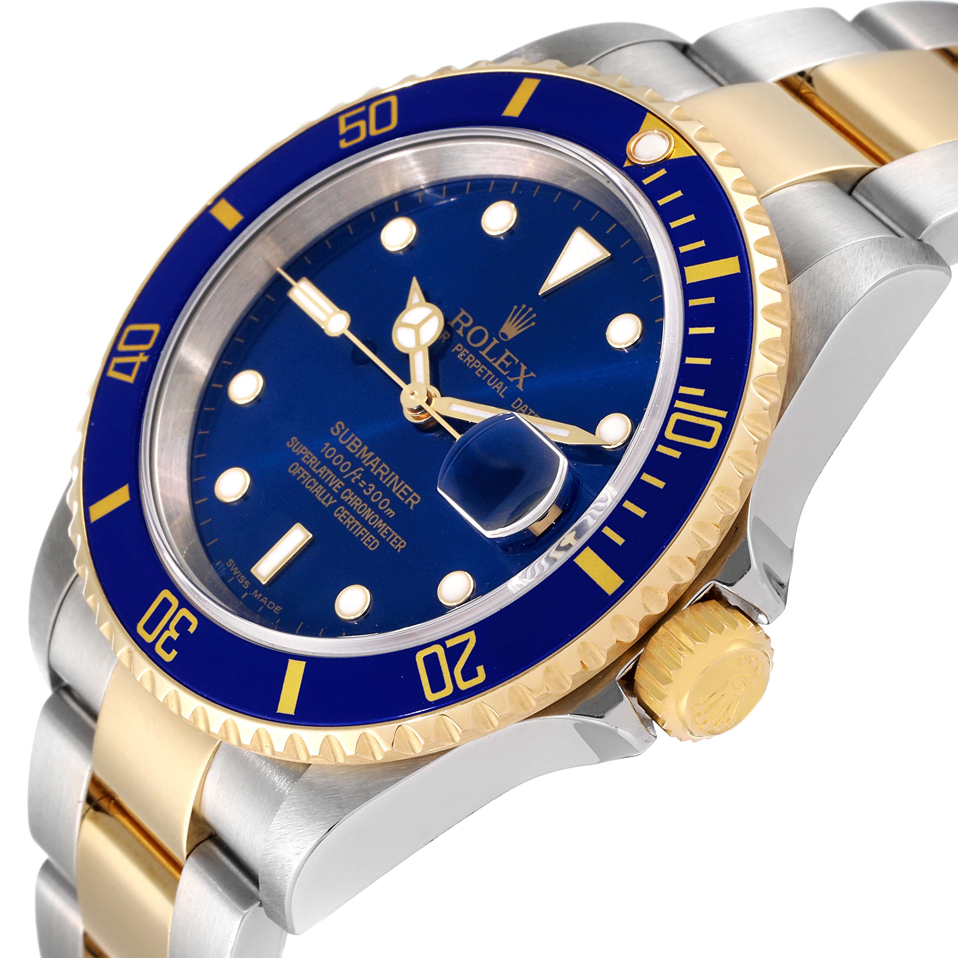 The image shows a Rolex Submariner 16613 Men's Steel and Gold (two tone) Blue Dial 16613 Men's Steel and Gold (two tone) Blue Dial watch at an oblique angle, highlighting its blue face, gold bezel, and crown.
