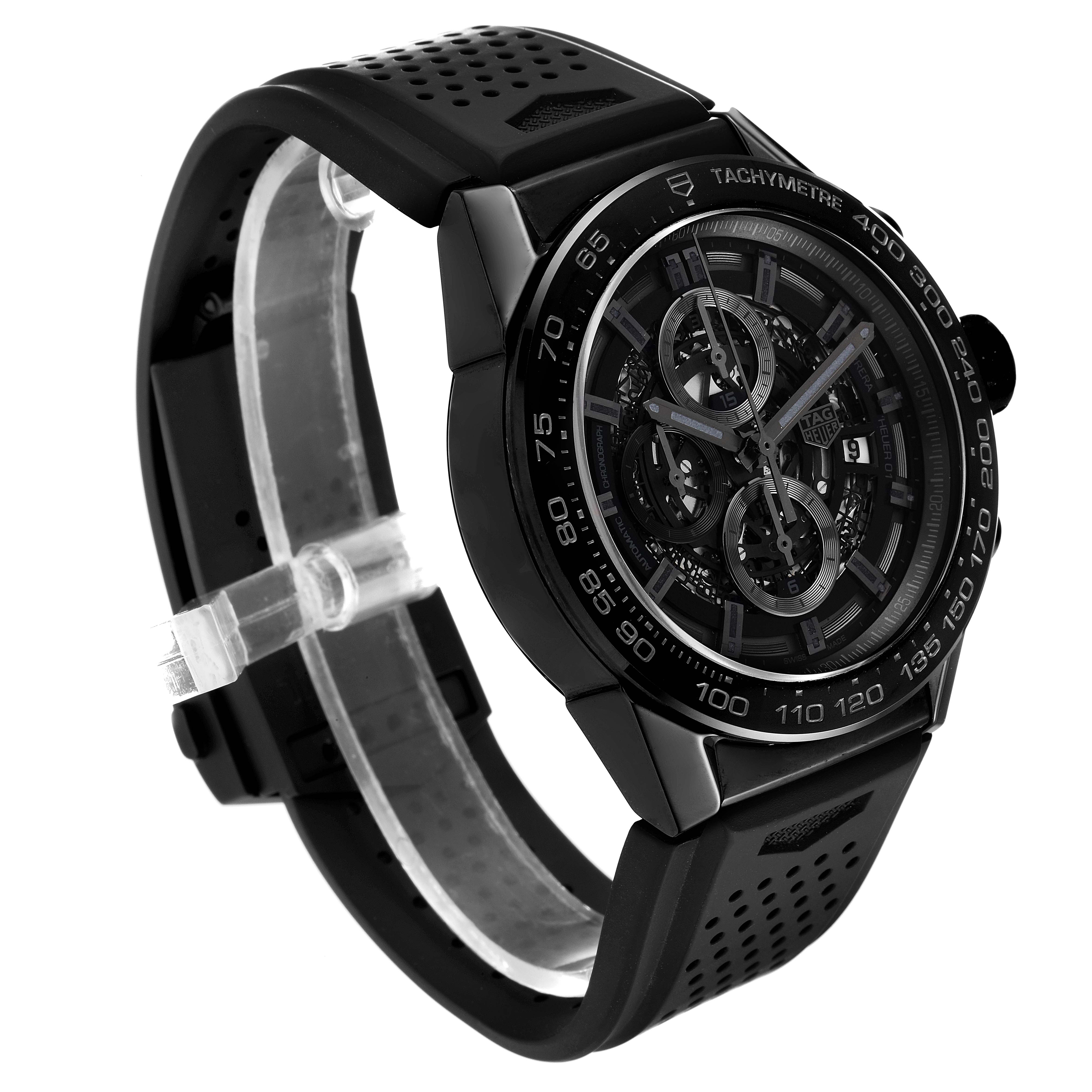 The watch is a Tag Heuer Carrera CAR2A90.FT6071 Men's Ceramic Black Dial CAR2A90.FT6071 Men's Ceramic Black Dial model shown in a three-quarter view, displaying the dial, strap, and tachymeter bezel.