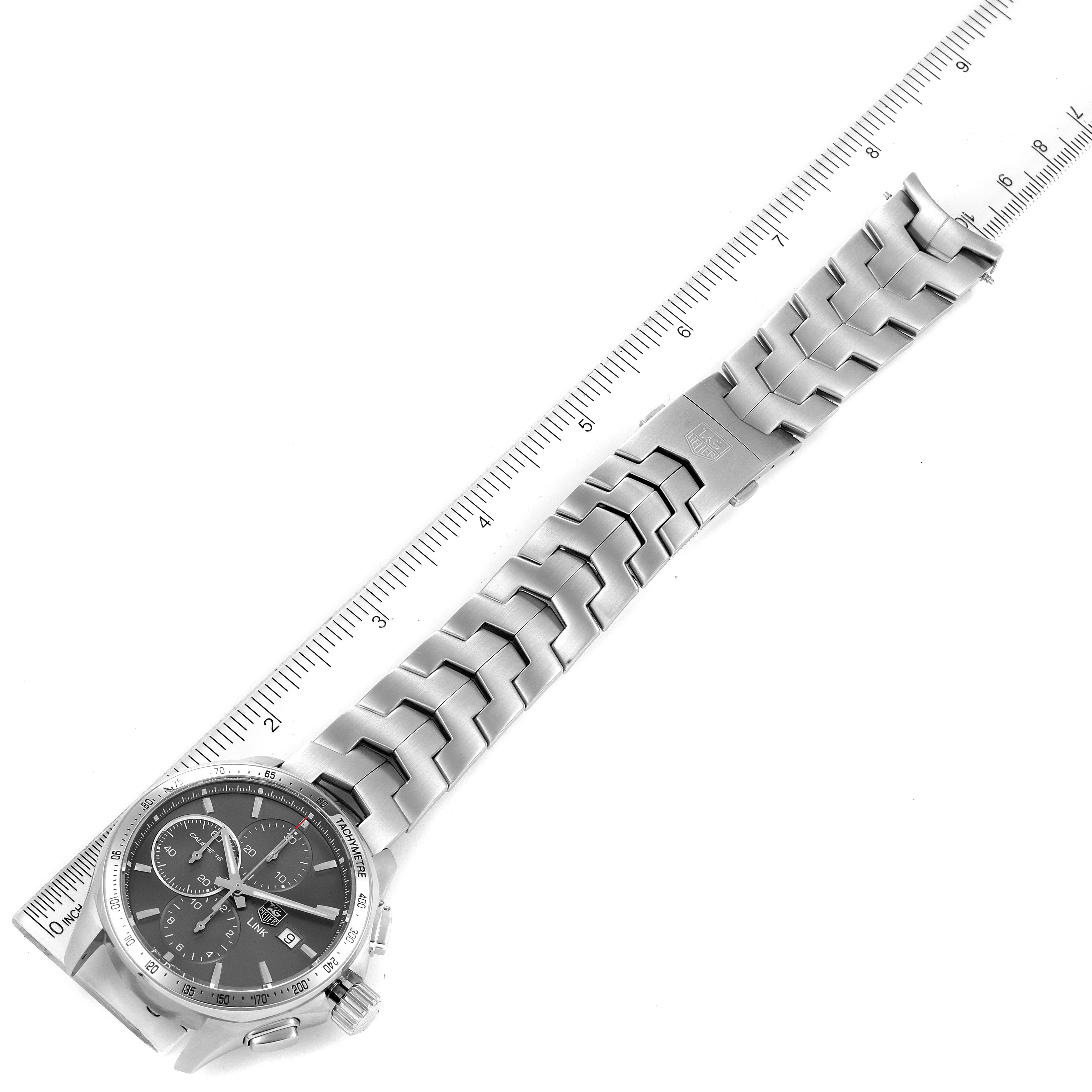 The image shows a top-down view of a Tag Heuer Link CAT2017.BA0952 Men's Stainless Steel Grey Dial CAT2017.BA0952 Men's Stainless Steel Grey Dial model watch, displaying the face, case, and bracelet with a ruler for scale.