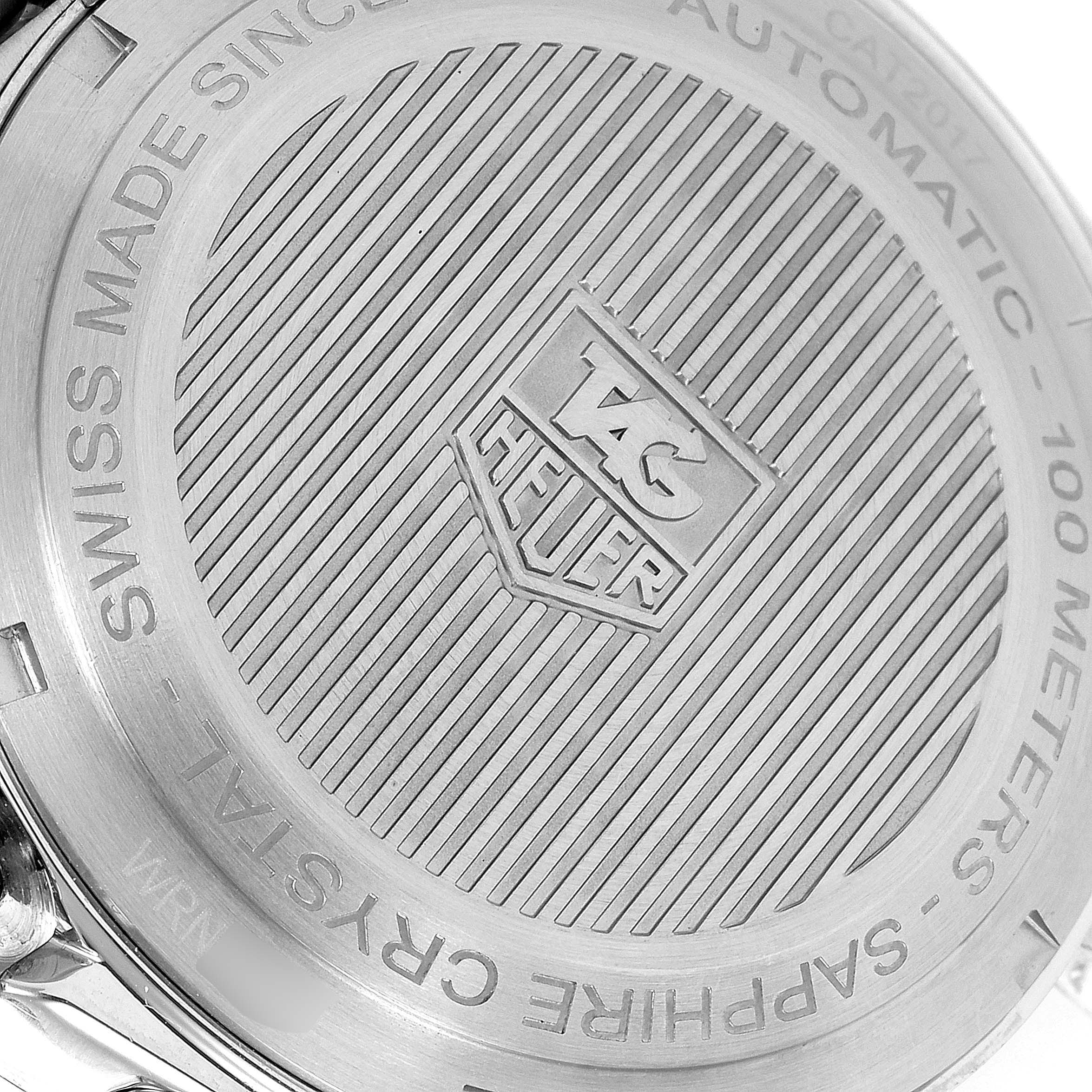 The image shows the back casing of a Tag Heuer Link CAT2017.BA0952 Men's Stainless Steel Grey Dial CAT2017.BA0952 Men's Stainless Steel Grey Dial model watch, highlighting the brand logo and engraved details.