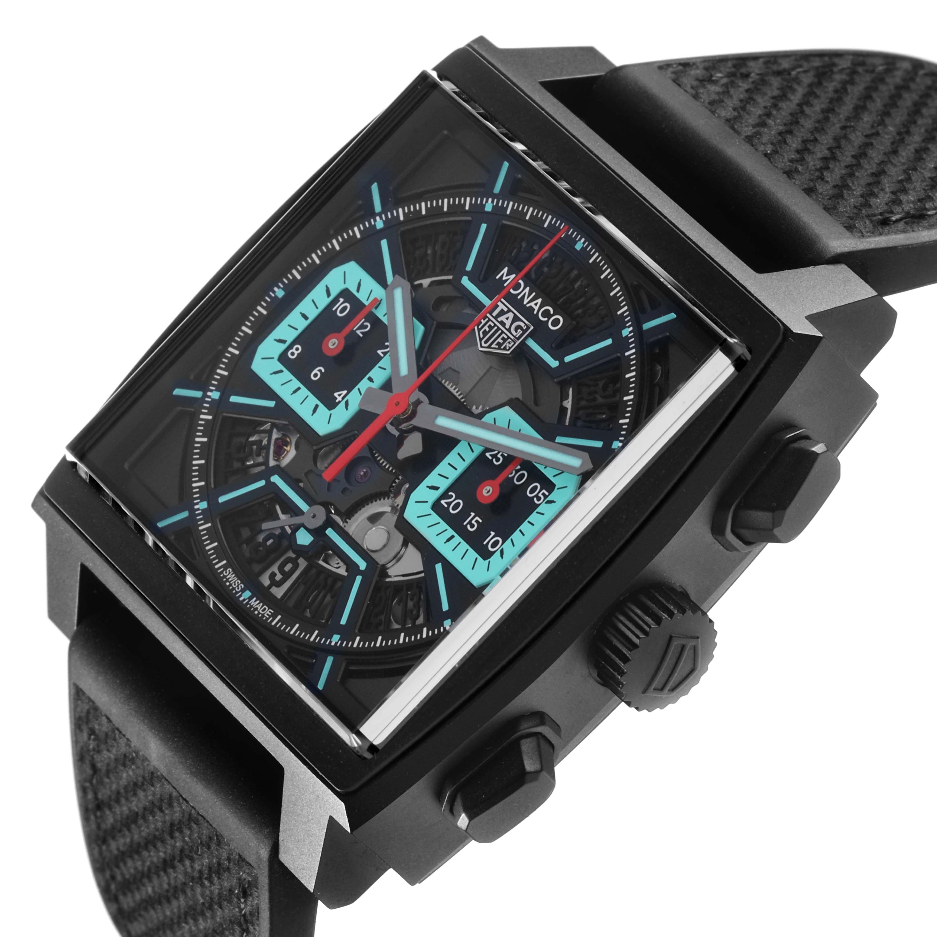 The Tag Heuer Monaco CBL2184.FT6236 Men's Titanium Black Dial CBL2184.FT6236 Men's Titanium Black Dial watch is shown at an angle highlighting the face, side buttons, and partial strap.