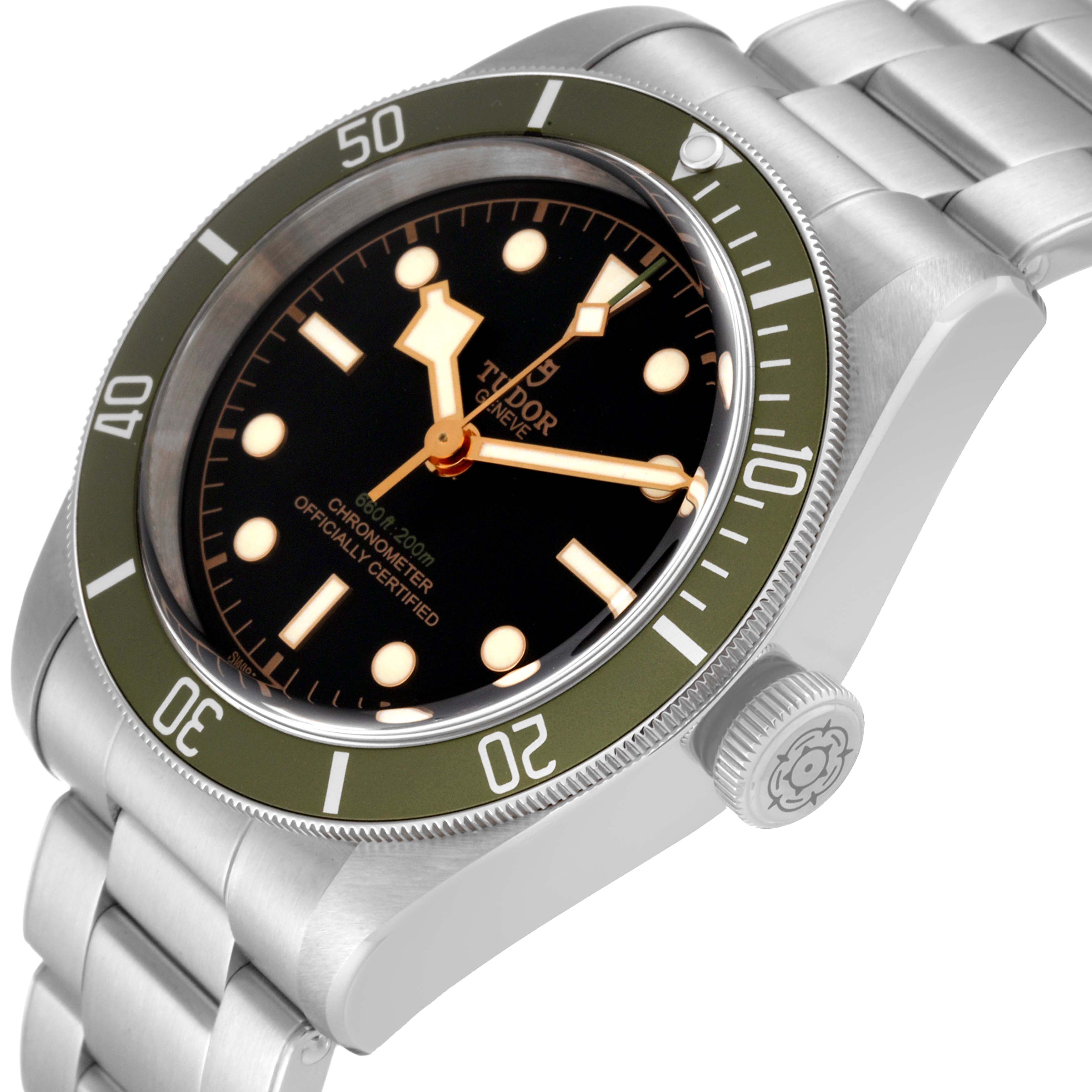 The image shows an angled view of the Tudor Heritage Black Bay 79230G Men
s Stainless Steel Black Dial 79230G Men
s Stainless Steel Black Dial watch, highlighting the bezel, dial, crown, and part of the bracelet.