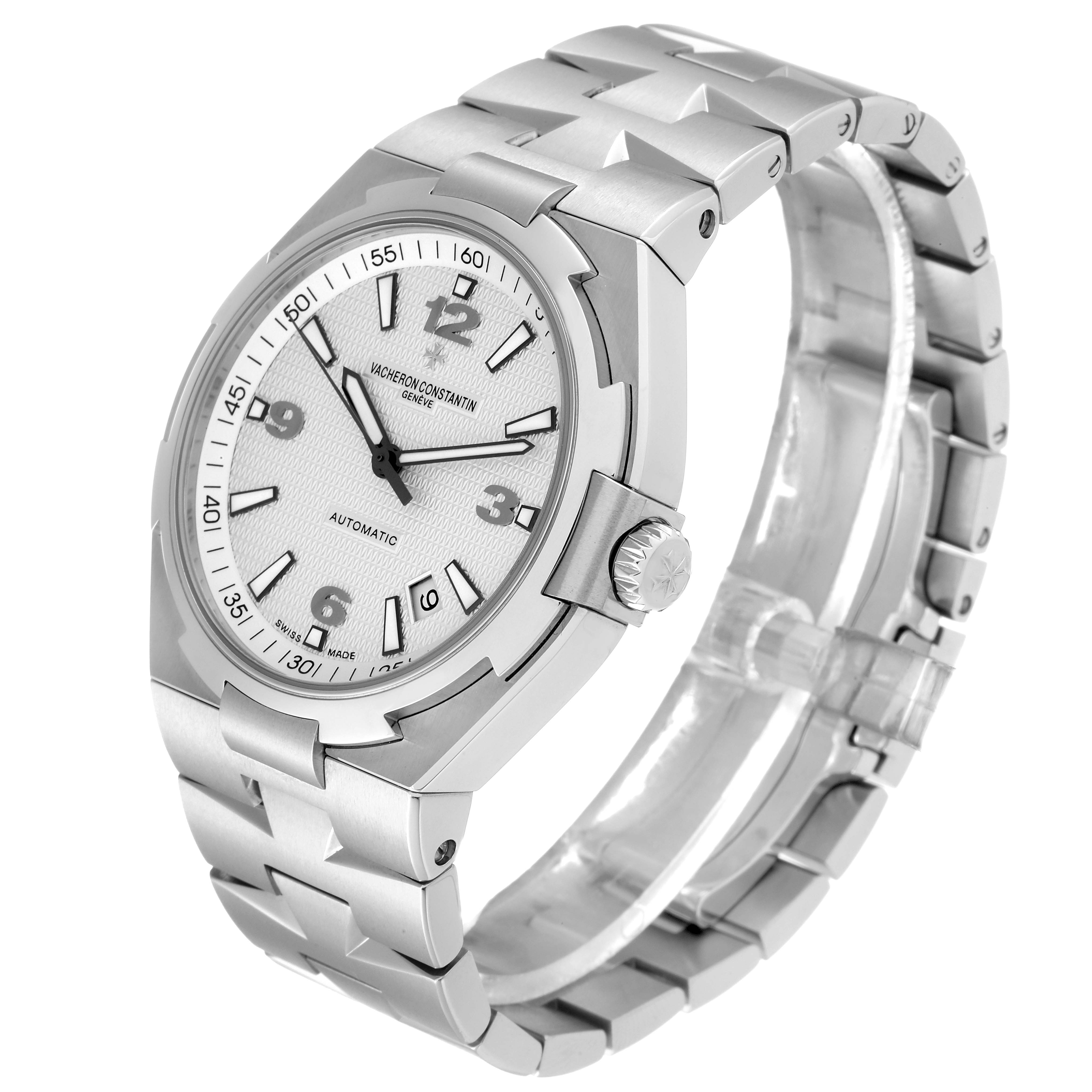 The image shows a side-angle view of the Vacheron Constantin Overseas 47040/B01A-9093 Men's Stainless Steel Silver Dial 47040/B01A-9093 Men's Stainless Steel Silver Dial model, highlighting its dial, crown, and bracelet.