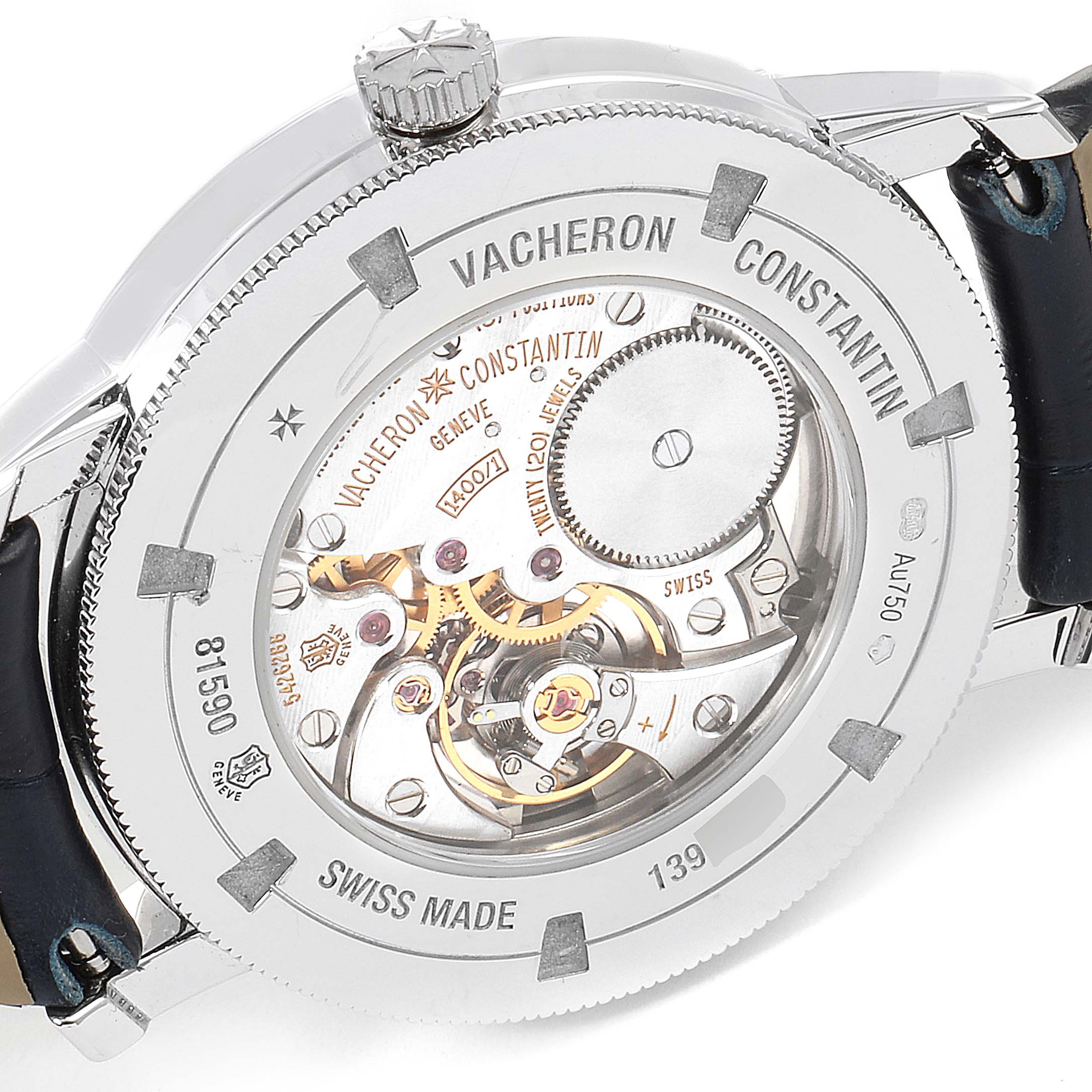 The image shows the back view of a Vacheron Constantin Traditionnelle 81590/000G-9848 Women's White Gold Silver Dial 81590/000G-9848 Women's White Gold Silver Dial watch, revealing its intricate movement and case details.