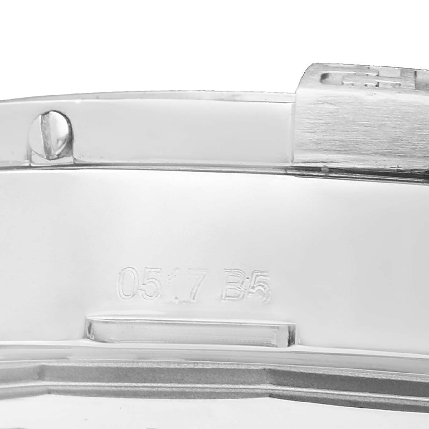 This image shows a close-up angle of the metal bracelet or clasp of a Breitling Avenger A32390 Men's Stainless Steel Blue Dial A32390 Men's Stainless Steel Blue Dial watch with visible engraving and a screw.