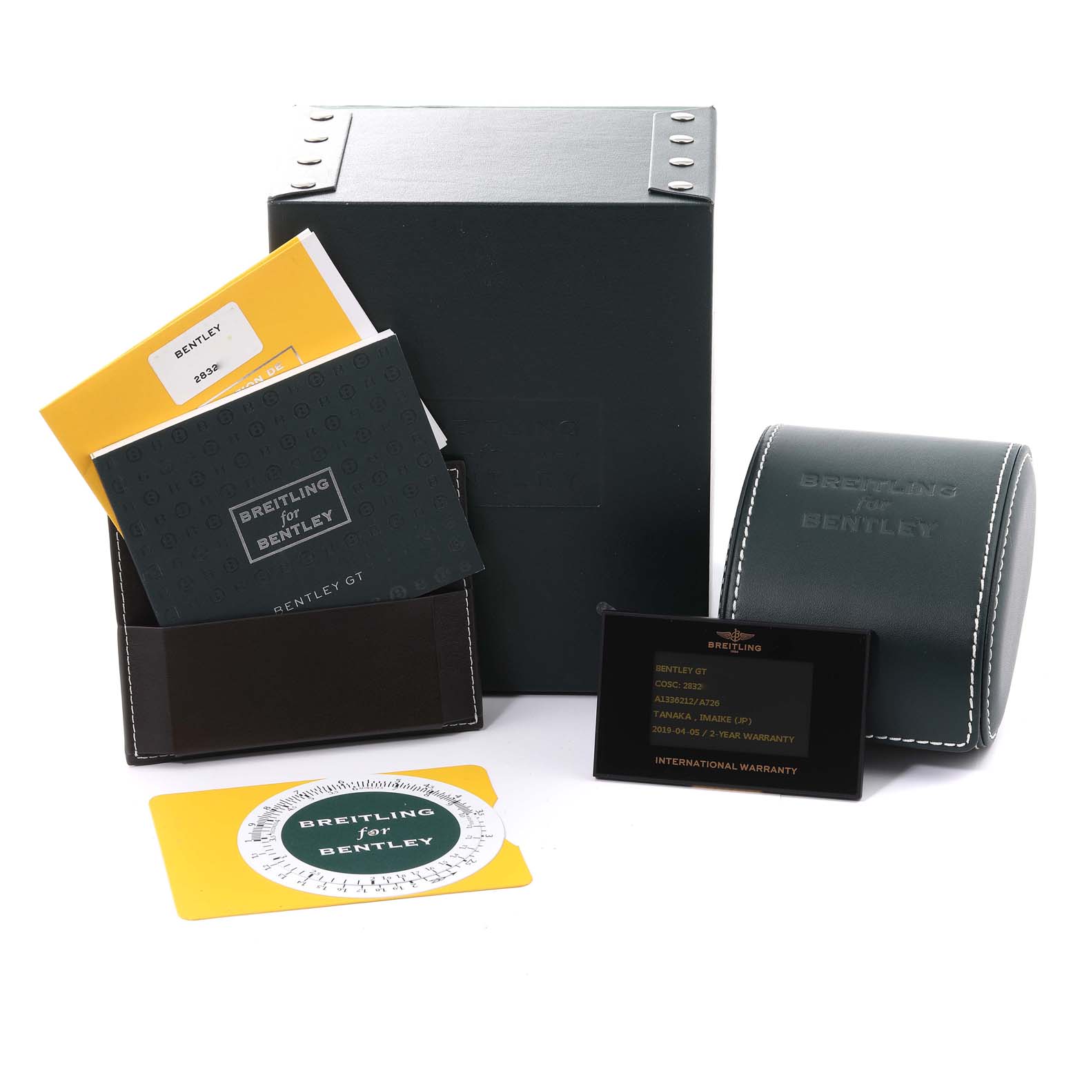 The image shows the packaging, manuals, warranty card, and a box for the Bentley model by Breitling.