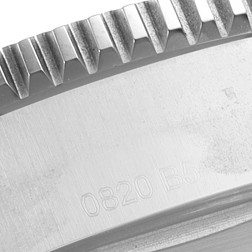 The image shows a close-up angle of the bezel and part of the case with engraving on the Breitling Superocean A17366 Men's Stainless Steel Orange Dial A17366 Men's Stainless Steel Orange Dial model watch.