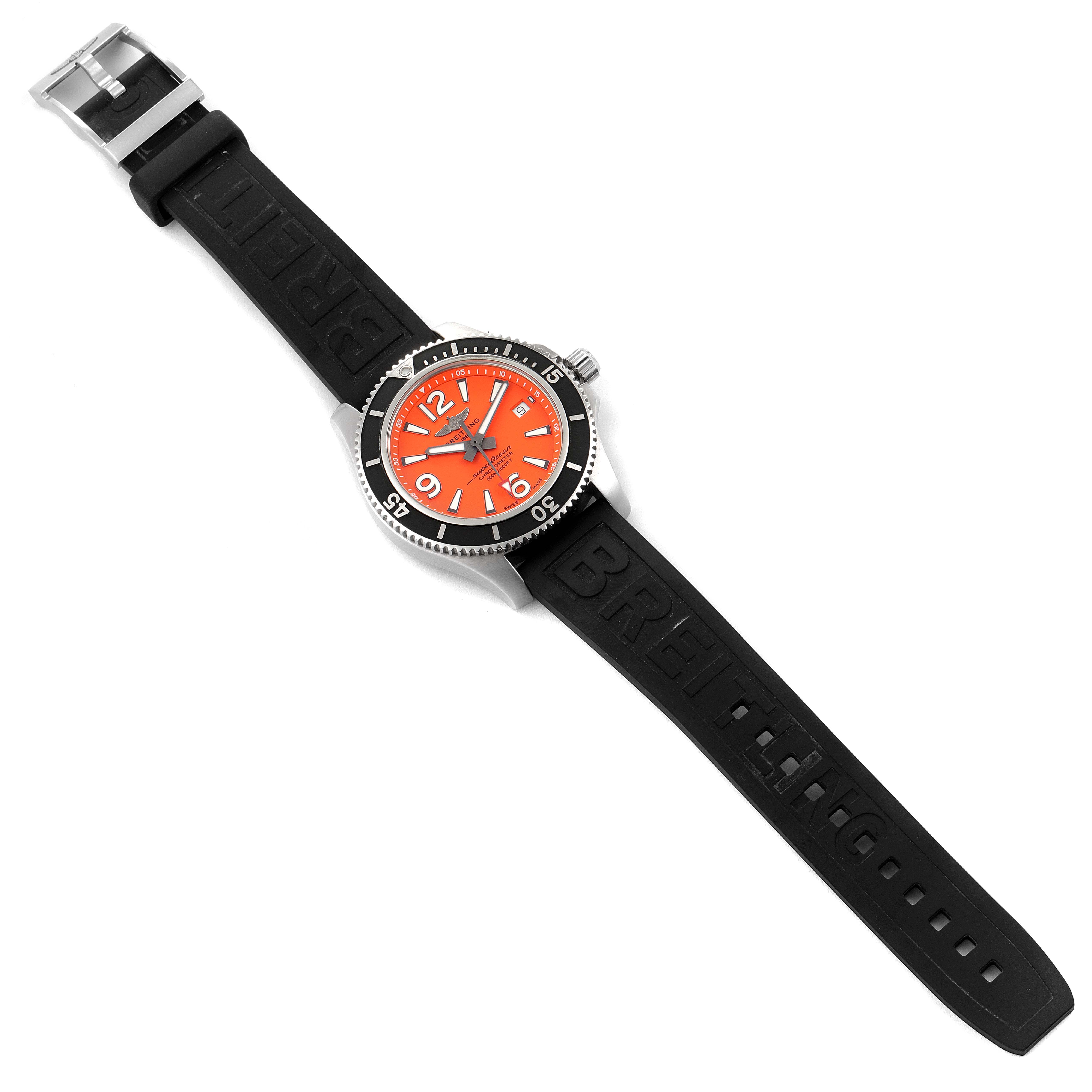 The Breitling Superocean A17366 Men's Stainless Steel Orange Dial A17366 Men's Stainless Steel Orange Dial watch is shown from a top-down angle, displaying the orange dial, black bezel, and black rubber strap with "Breitling" branding.