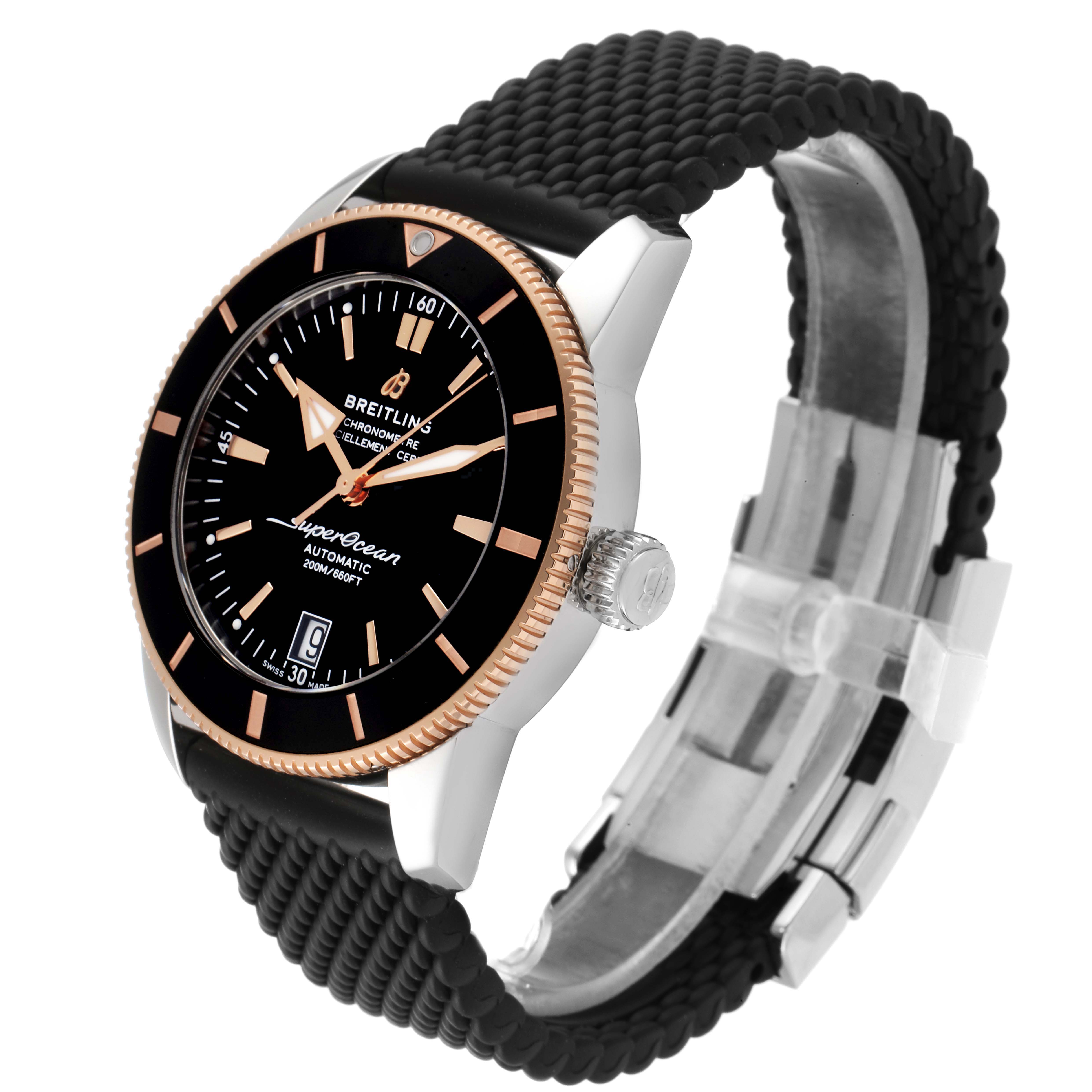 The Breitling Superocean UB201012/BG53/154A Men's Steel and Gold (two tone) Black Dial UB201012/BG53/154A Men's Steel and Gold (two tone) Black Dial watch is shown at a three-quarter angle, showcasing its face, bezel, crown, and strap.