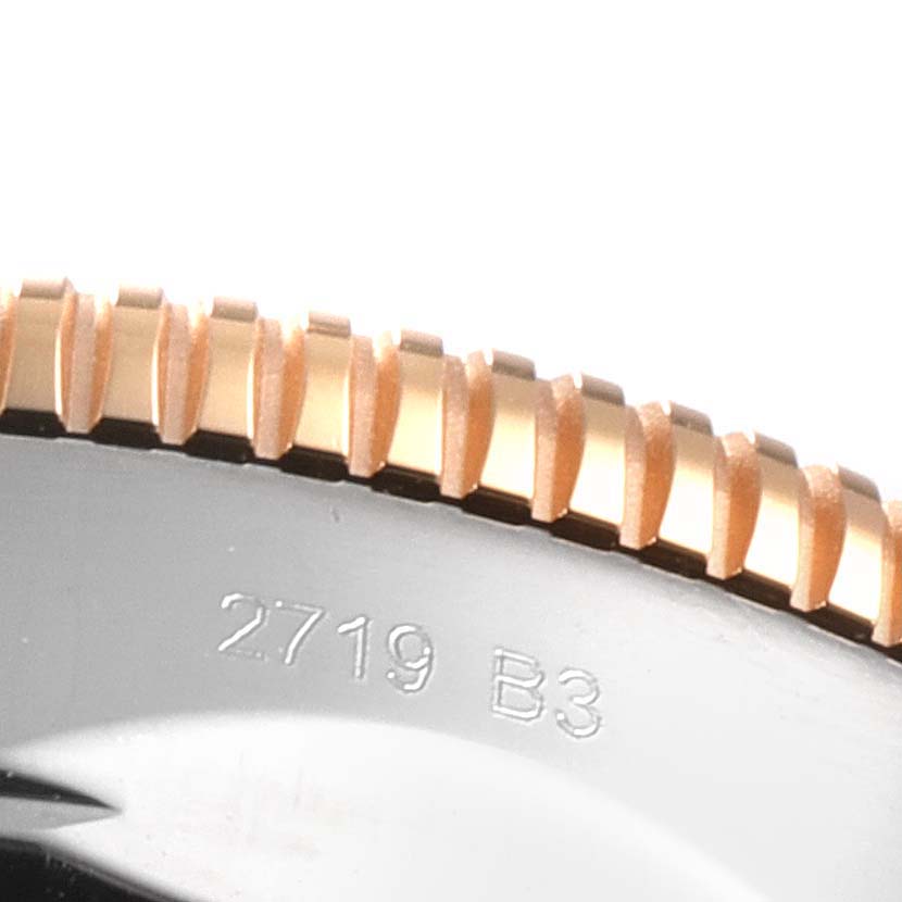 Close-up of the bezel and part of the casing of a Breitling Superocean UB201012/BG53/154A Men's Steel and Gold (two tone) Black Dial UB201012/BG53/154A Men's Steel and Gold (two tone) Black Dial watch, showing the edge and engraved numbers.