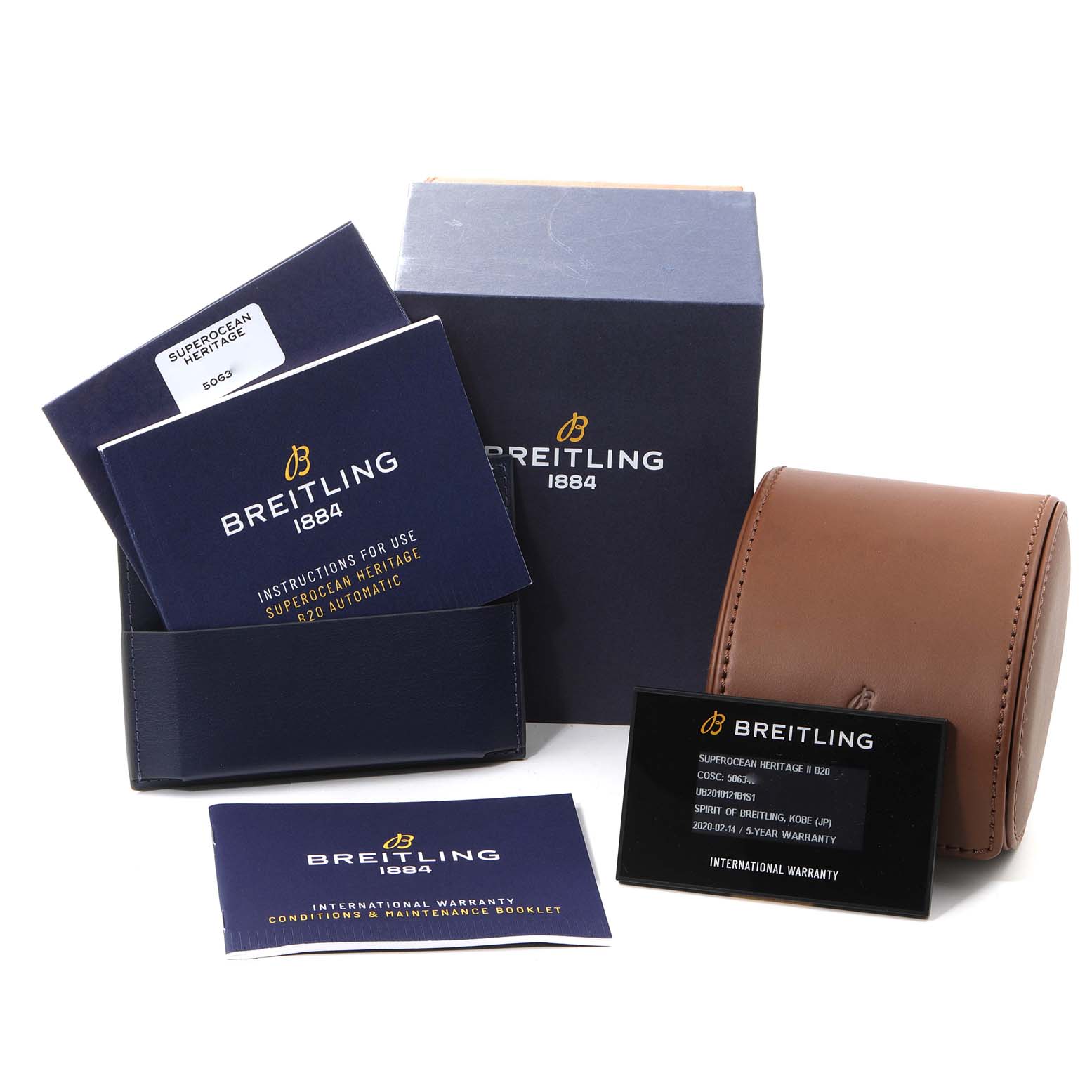 This image shows the packaging, documentation, and accessories for the Breitling Superocean UB201012/BG53/154A Men's Steel and Gold (two tone) Black Dial UB201012/BG53/154A Men's Steel and Gold (two tone) Black Dial model, including manuals, boxes, and warranty card.