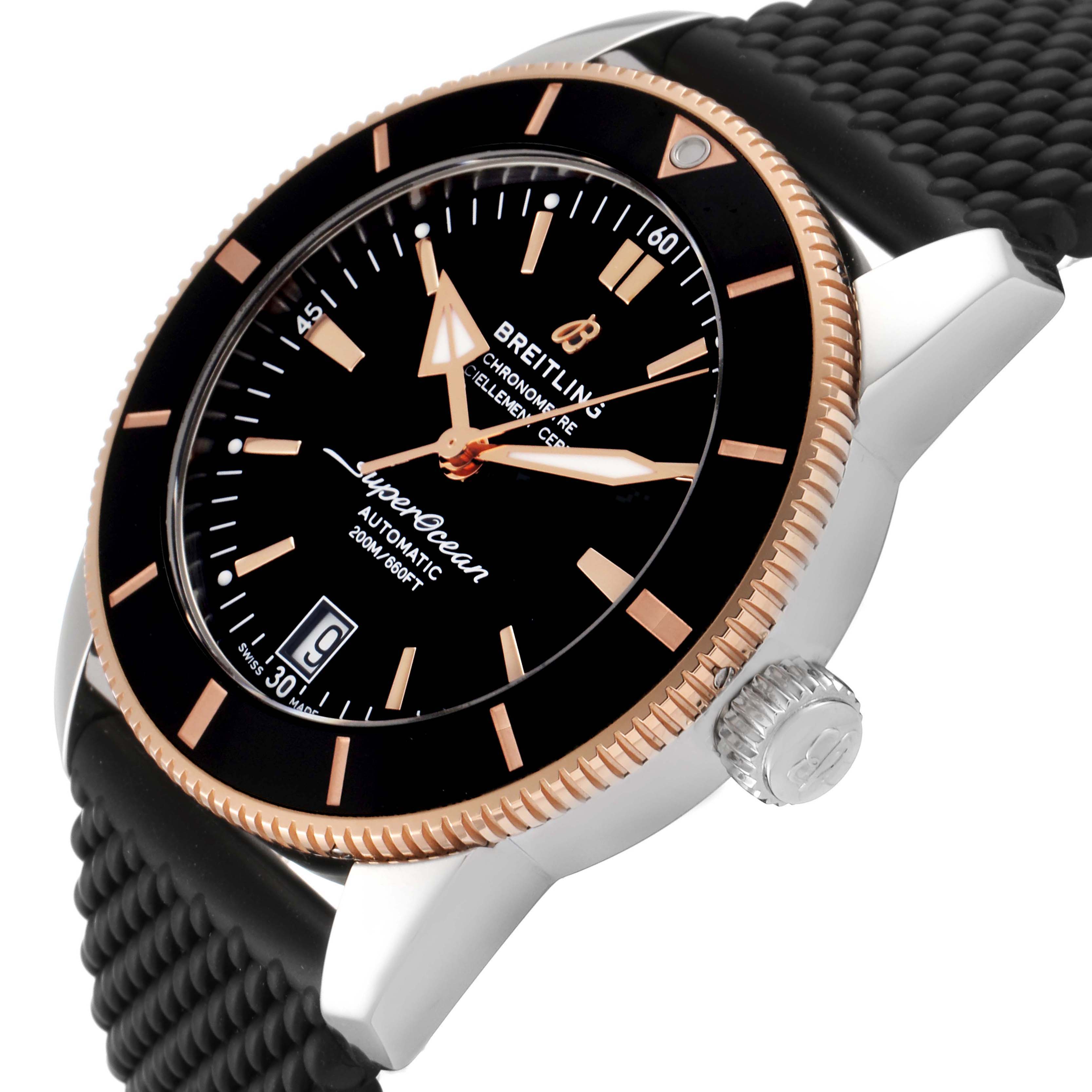 This image shows a close-up of the dial, bezel, crown, and part of the strap of a Breitling Superocean UB201012/BG53/154A Men's Steel and Gold (two tone) Black Dial UB201012/BG53/154A Men's Steel and Gold (two tone) Black Dial watch.