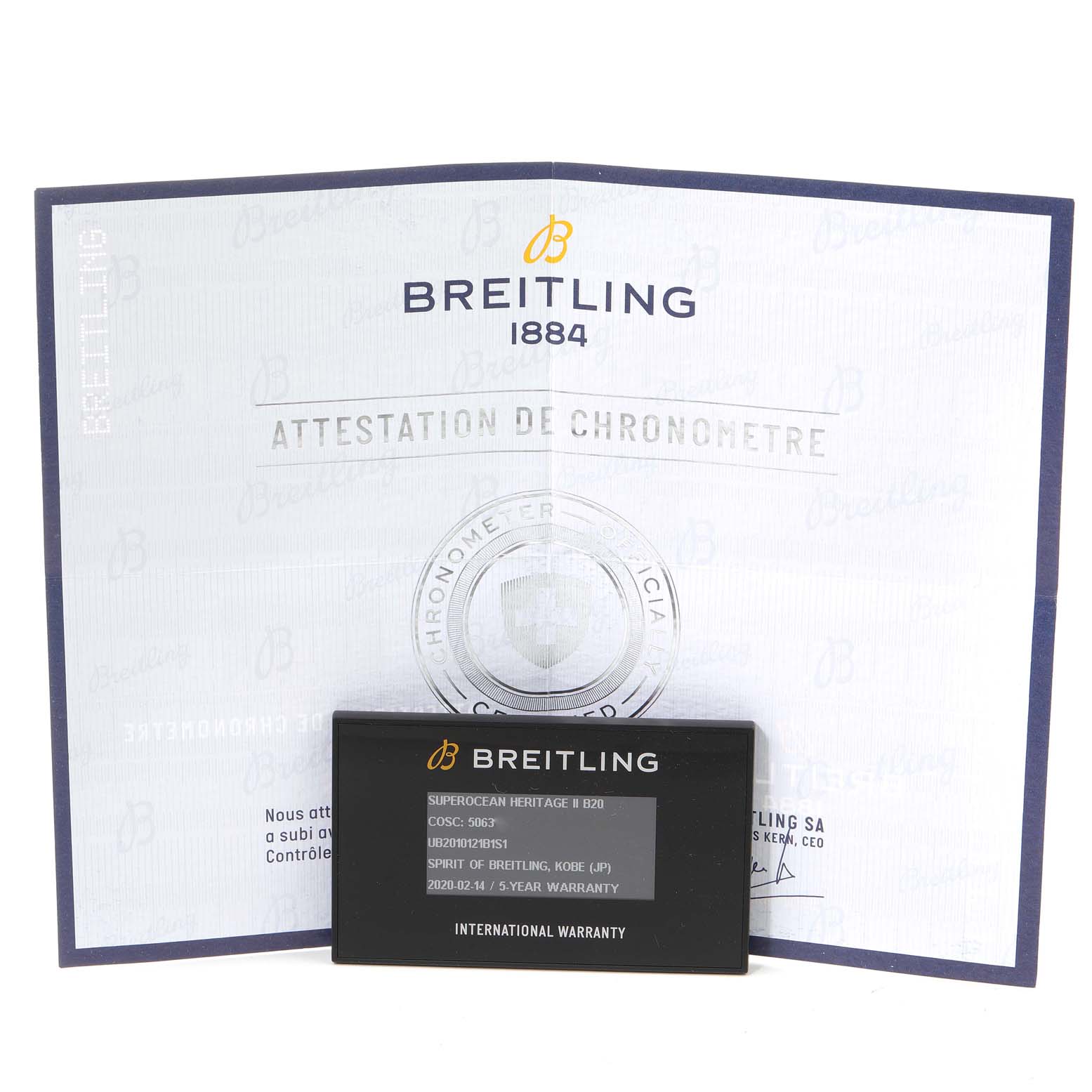 The image shows the Breitling Superocean UB201012/BG53/154A Men's Steel and Gold (two tone) Black Dial UB201012/BG53/154A Men's Steel and Gold (two tone) Black Dial model's chronometer certificate and international warranty card.