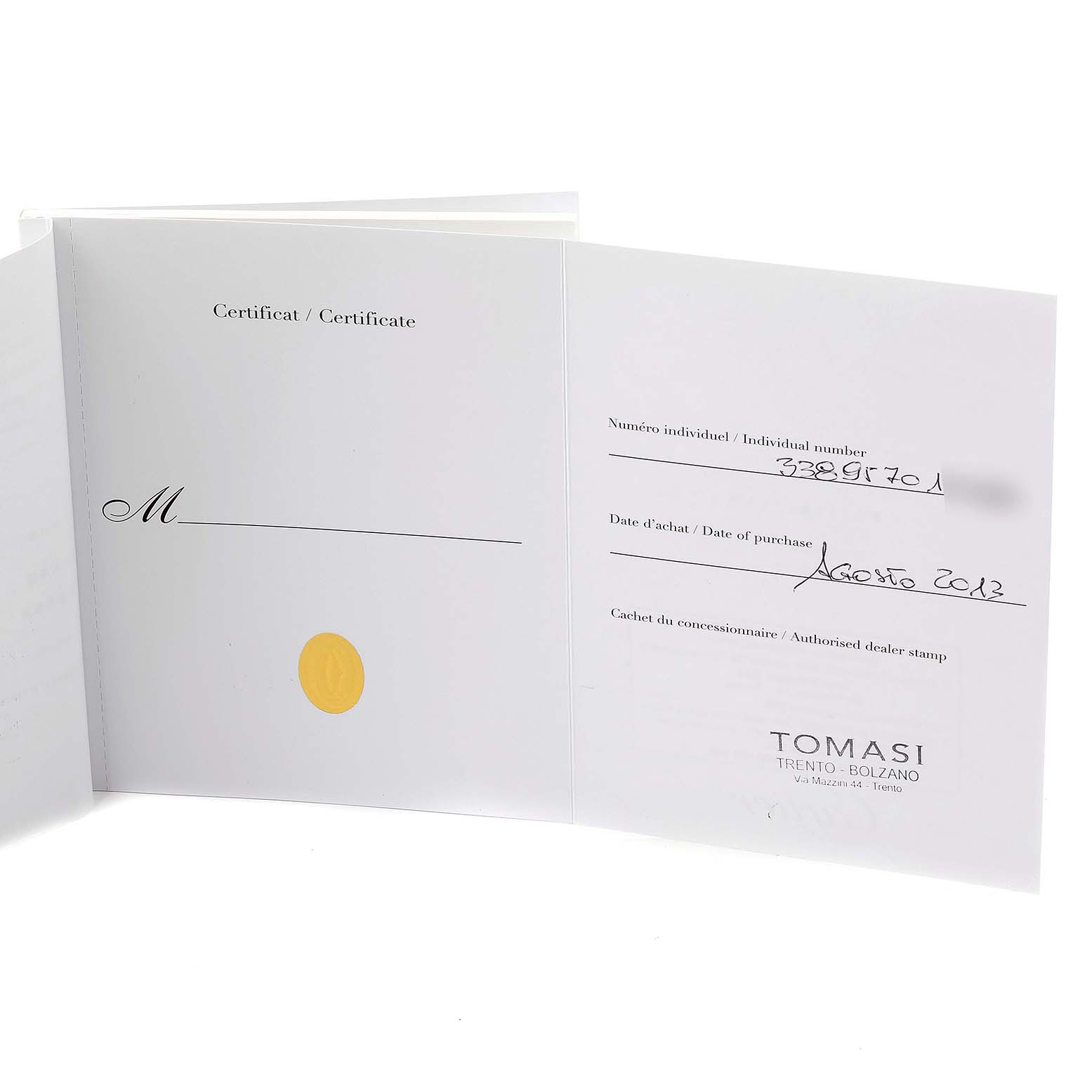 The image shows an open certificate of authenticity for a Calibre de Cartier watch by Cartier.