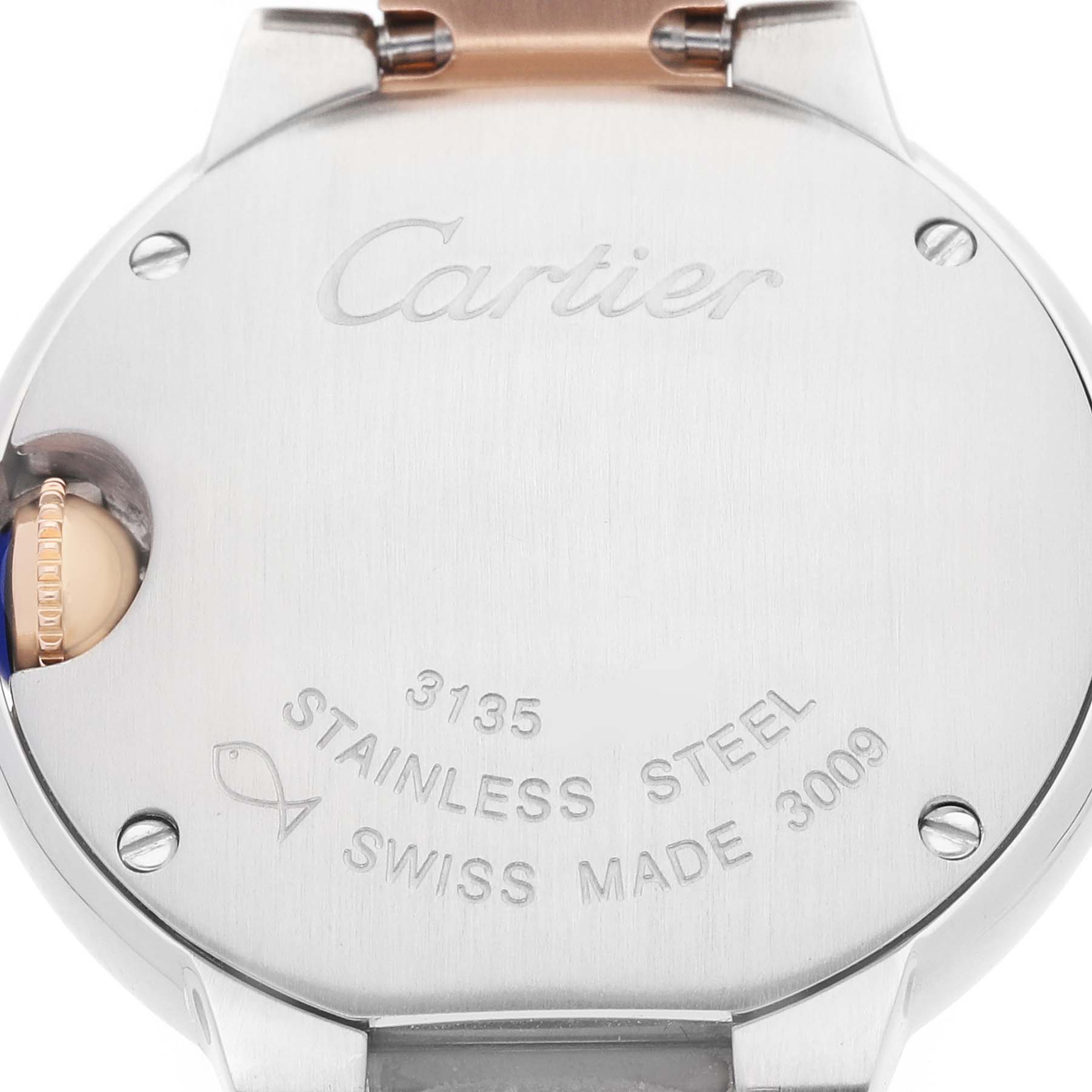 The image shows the back of a Cartier Ballon Bleu W6920034 Women's Steel and Gold (two tone) Mother of Pearl Dial watch, highlighting the stainless steel case and engravings.
